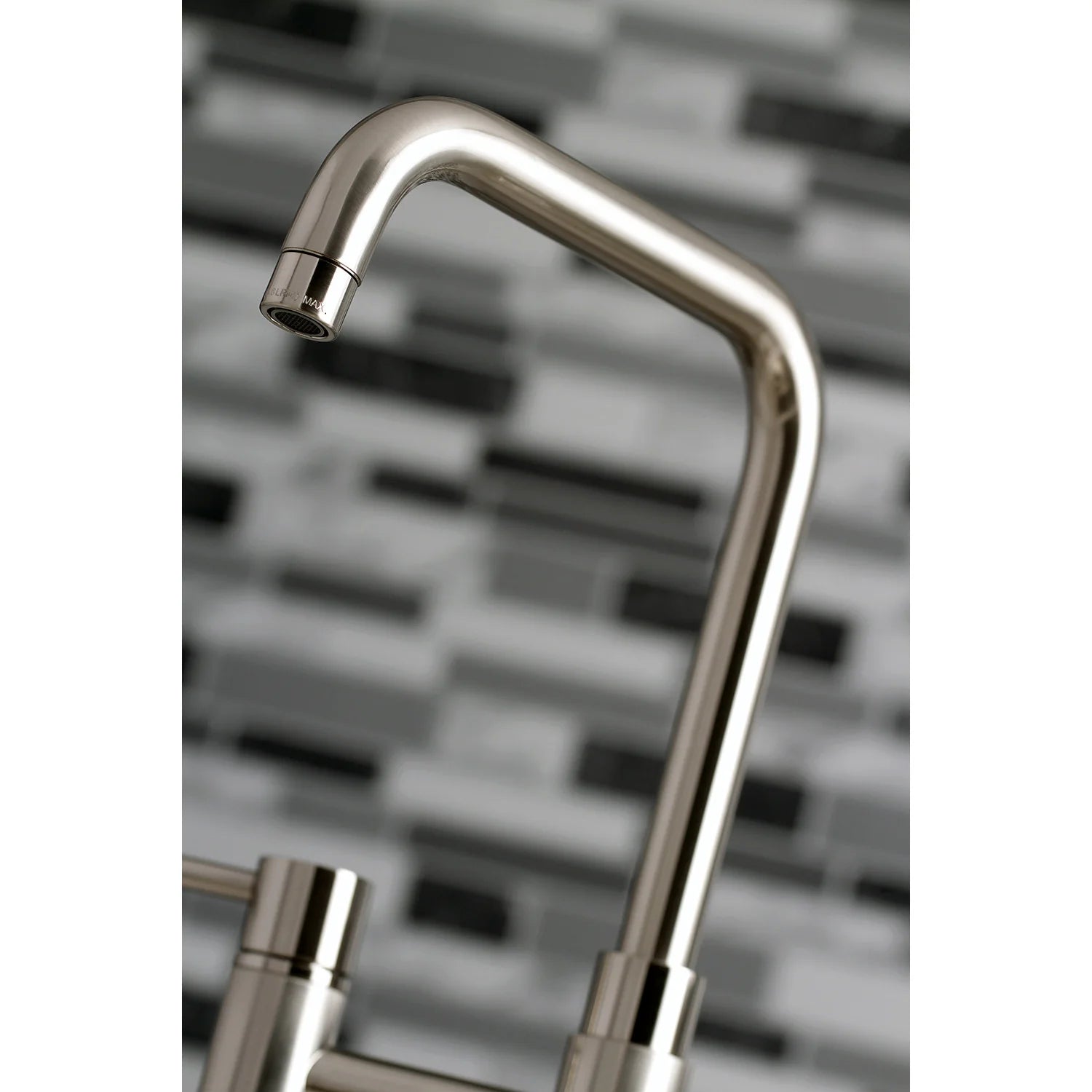 Brushed nickel arched faucet spout with smooth metal finish