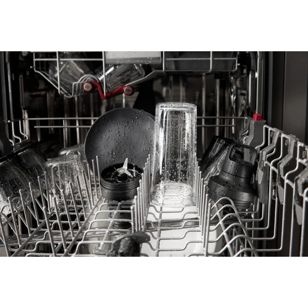 KitchenAid blender jar and parts in dishwasher with spray water