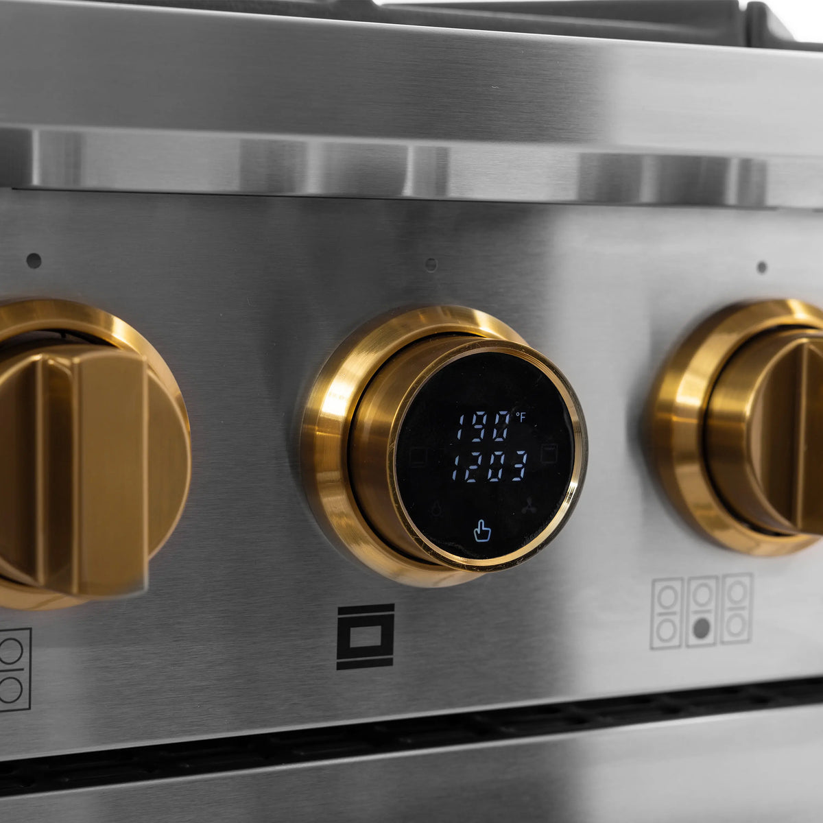 Stainless steel dual fuel range control panel with gold knob and digital temperature display
