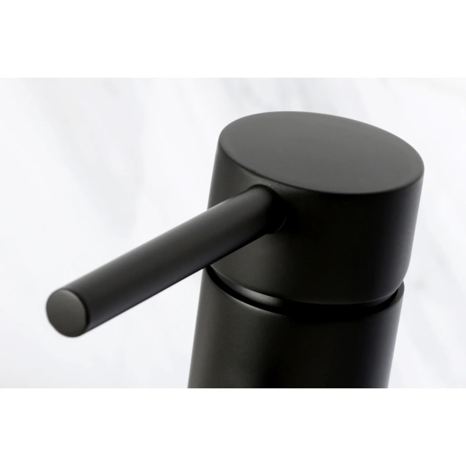 Matte black faucet deck mount with lever handle and smooth circular top
