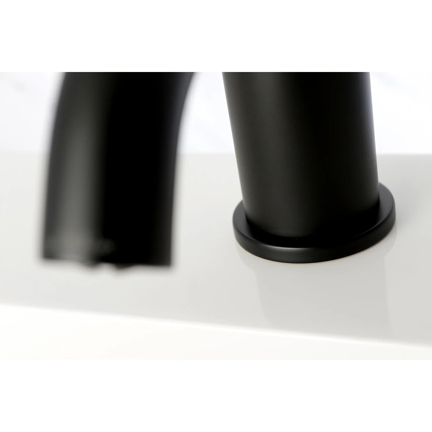 Matte black faucet base with round mounting base and cylindrical body