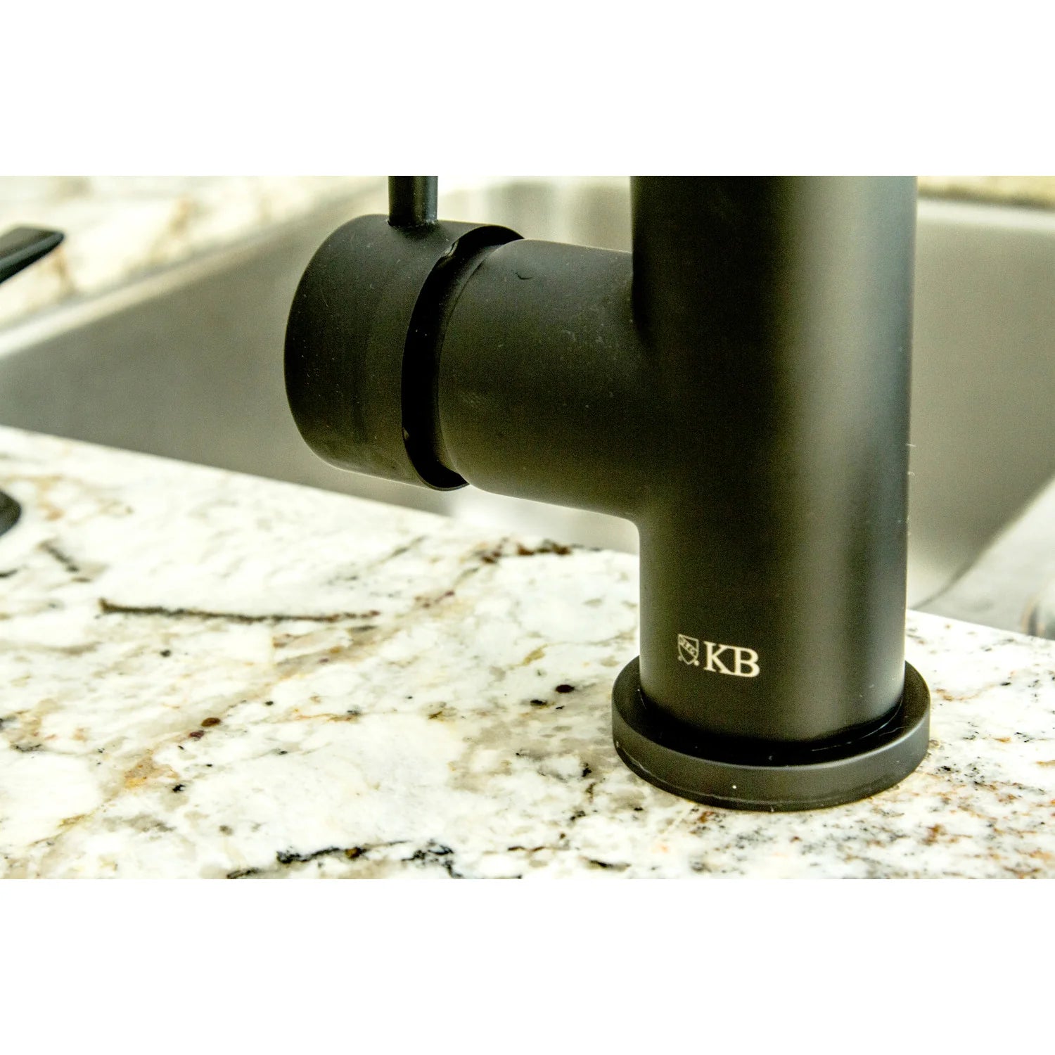 Matte black pull-down faucet base with embossed KB logo