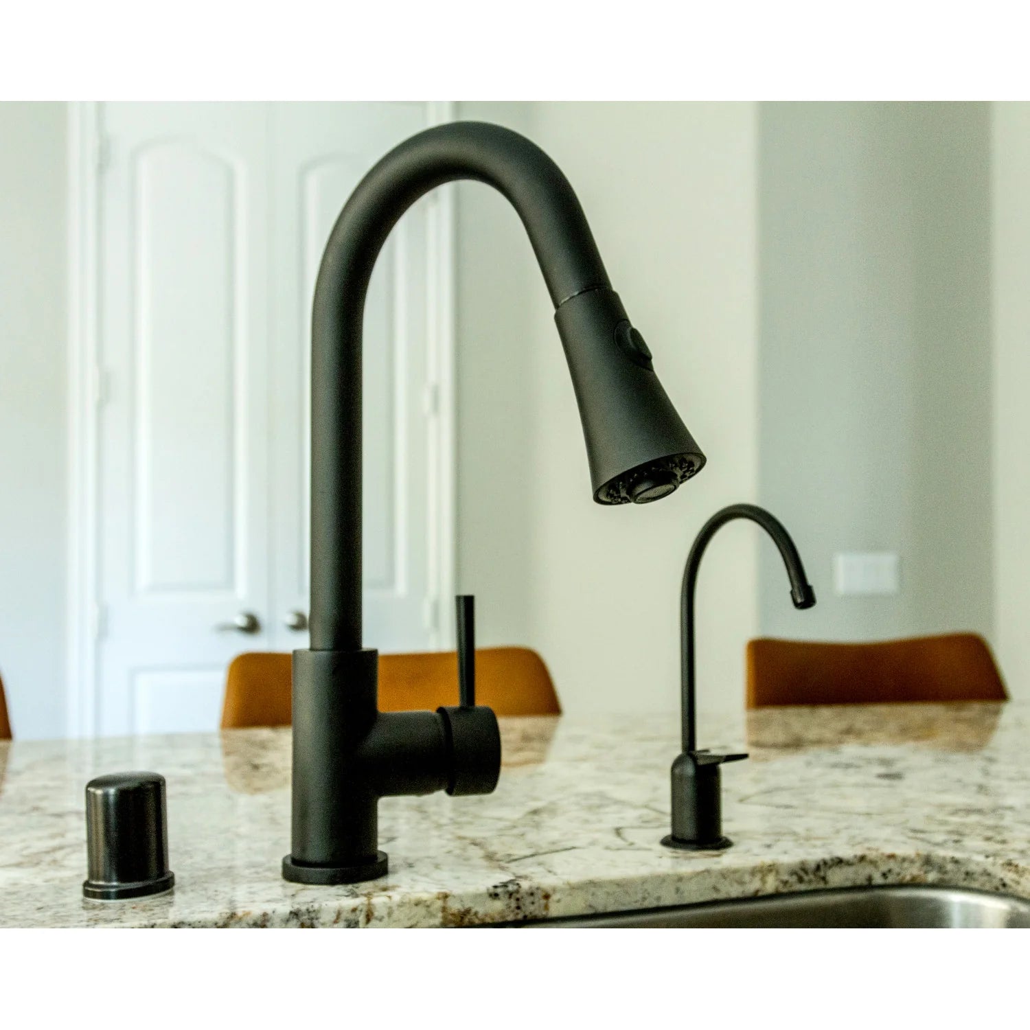 Matte black pull-down kitchen faucet with single lever and spray head