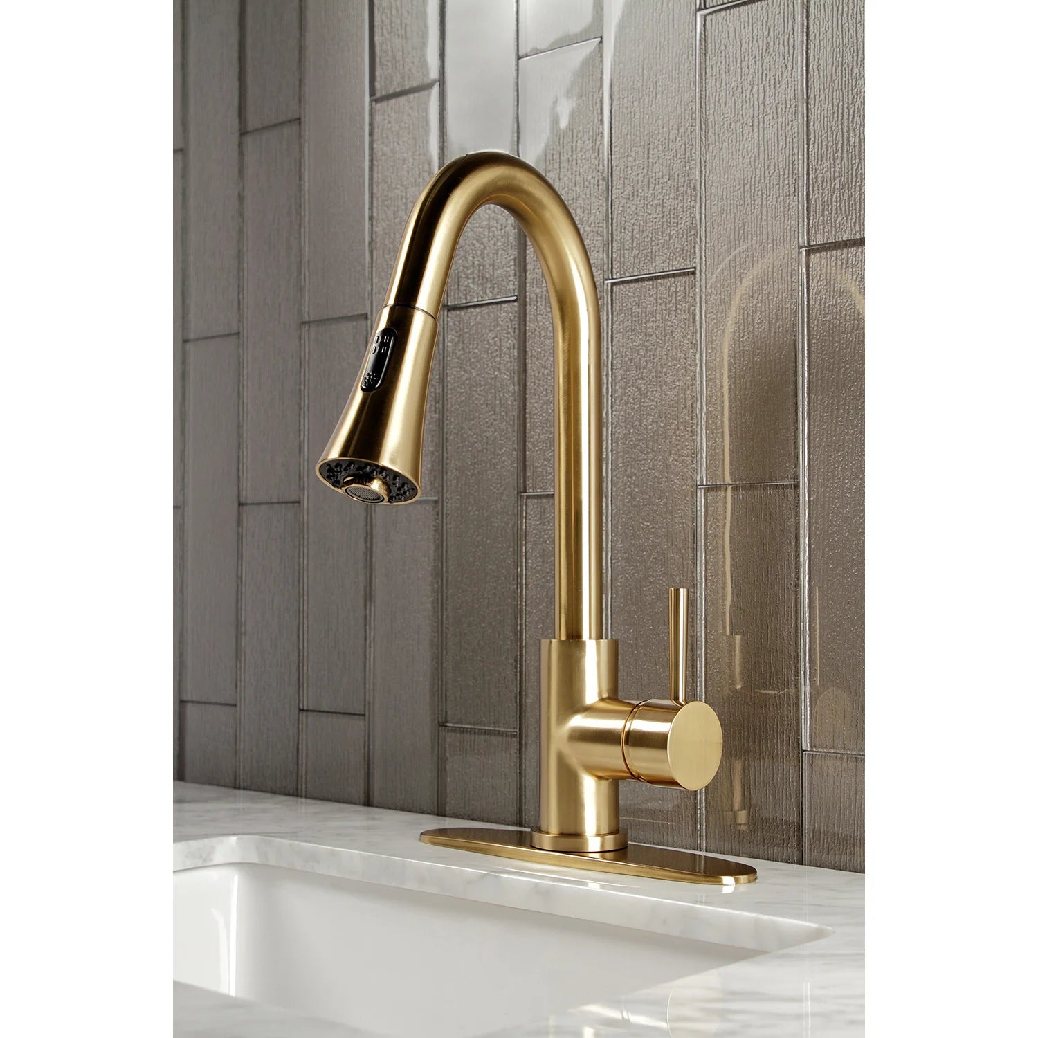 Brushed brass single-handle kitchen faucet with pull-down sprayer and wide deck plate