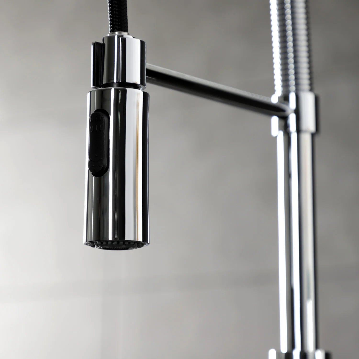Polished chrome faucet handle and spout with vertical spray hose