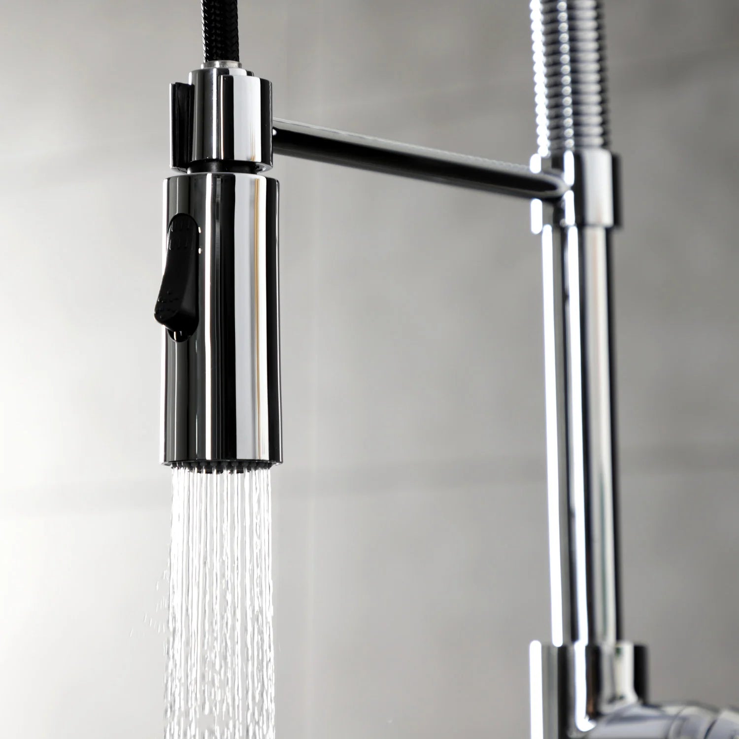 Polished chrome faucet head with flexible spray hose and water stream