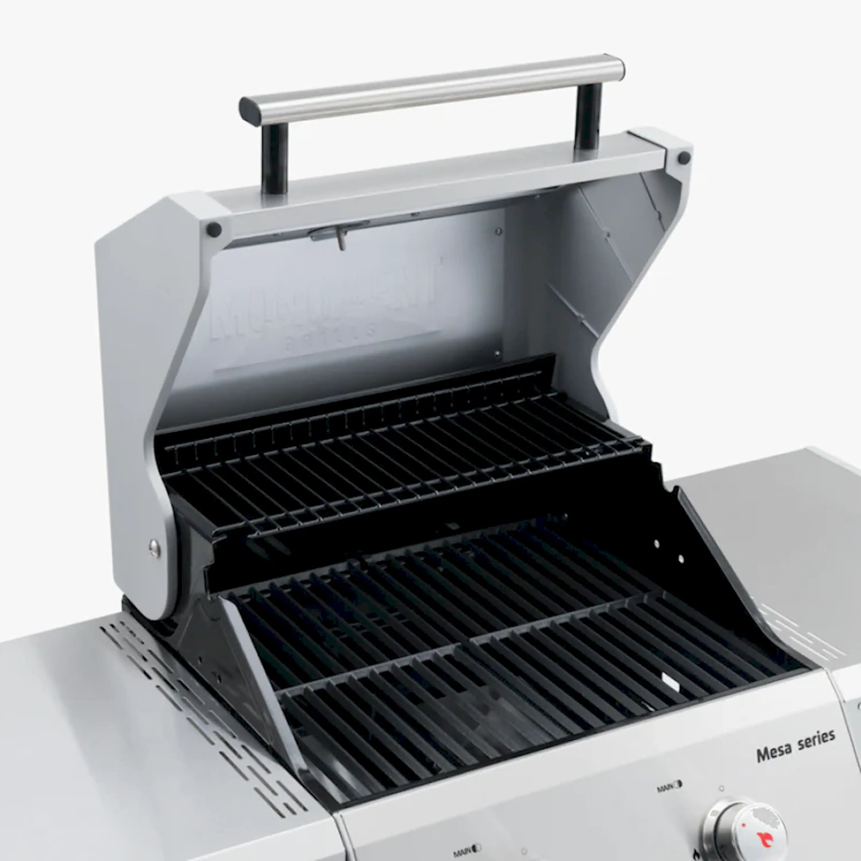 Propane grill open with black grates and warming rack above