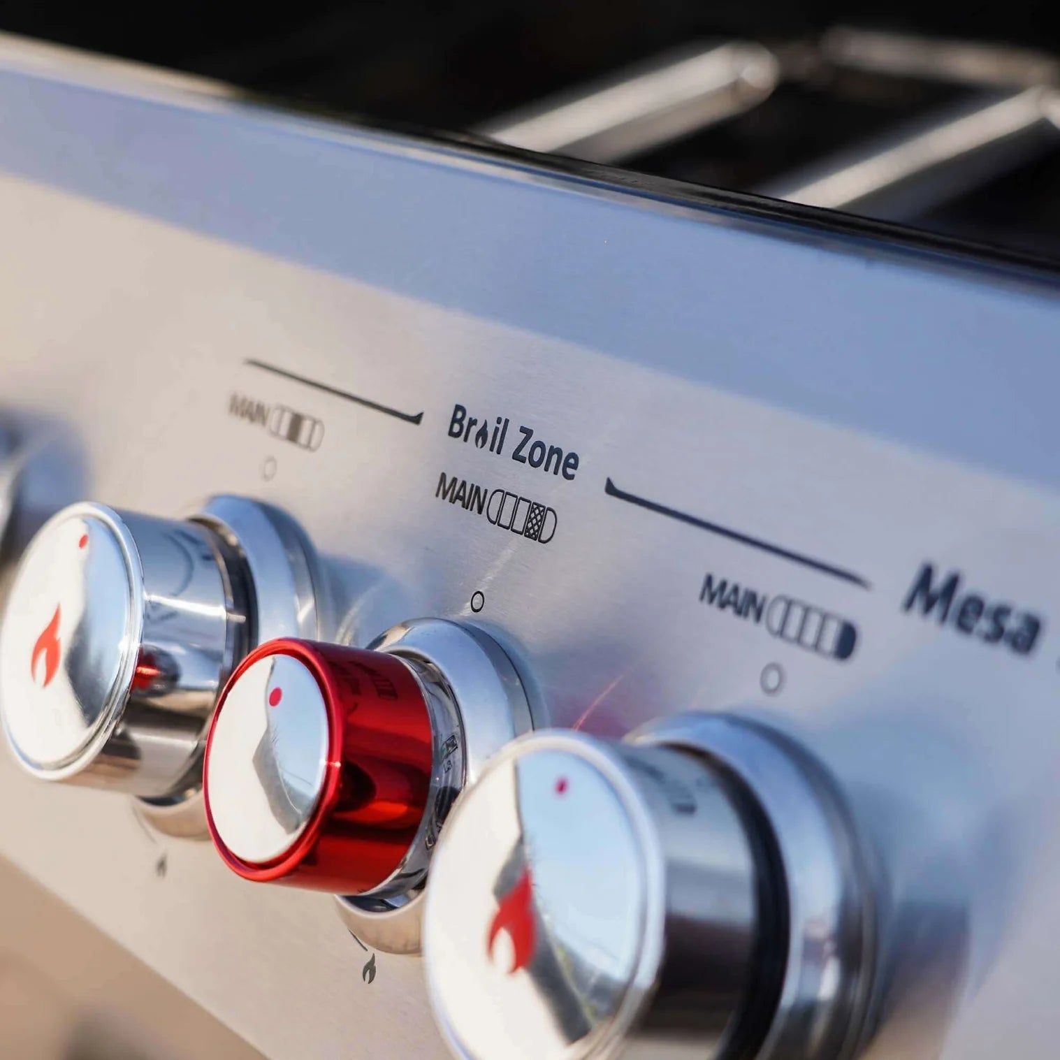 Stainless steel propane grill control knobs with red flame indicator lights