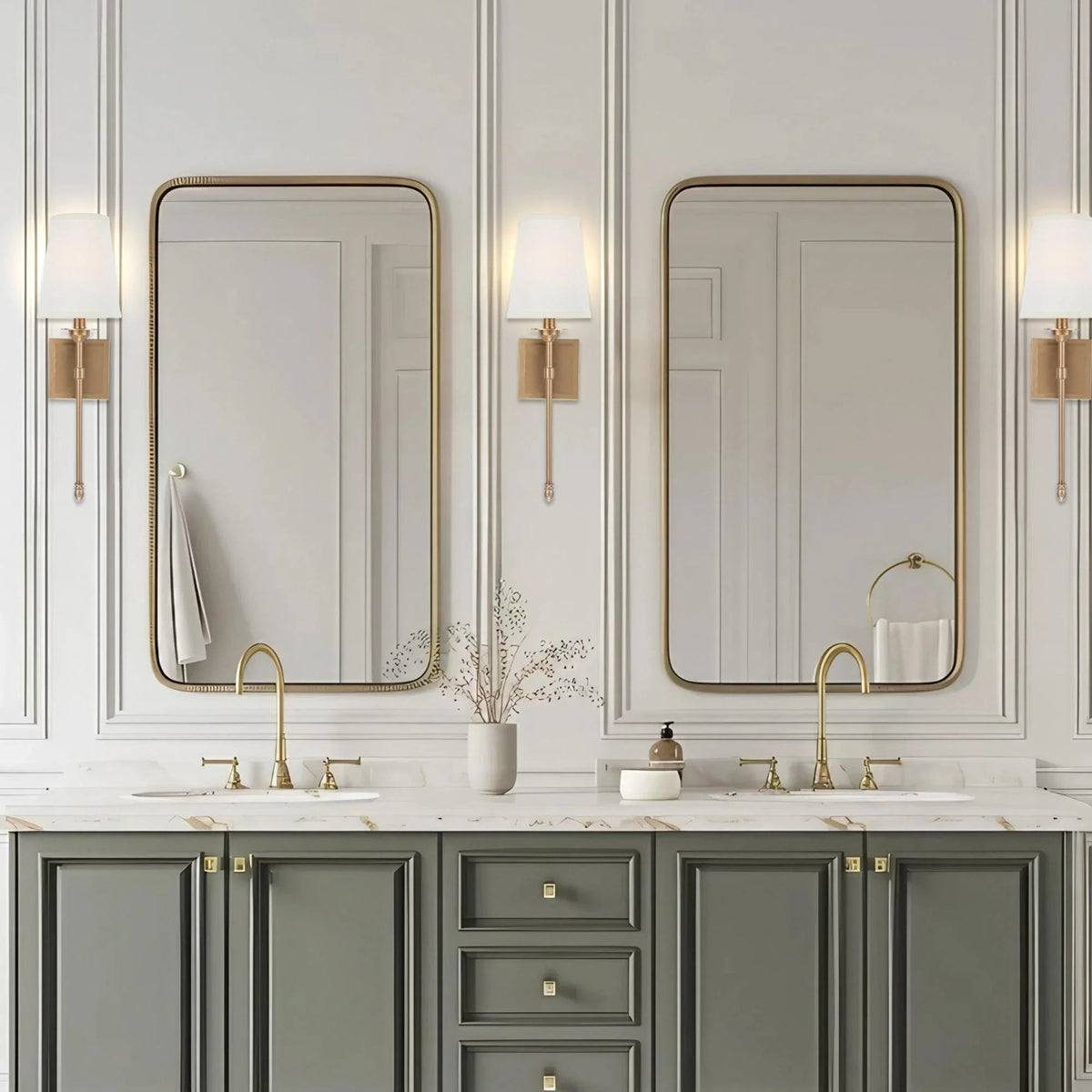 Golden wall sconce with rectangular backplate and white drum shade, curved metal arms