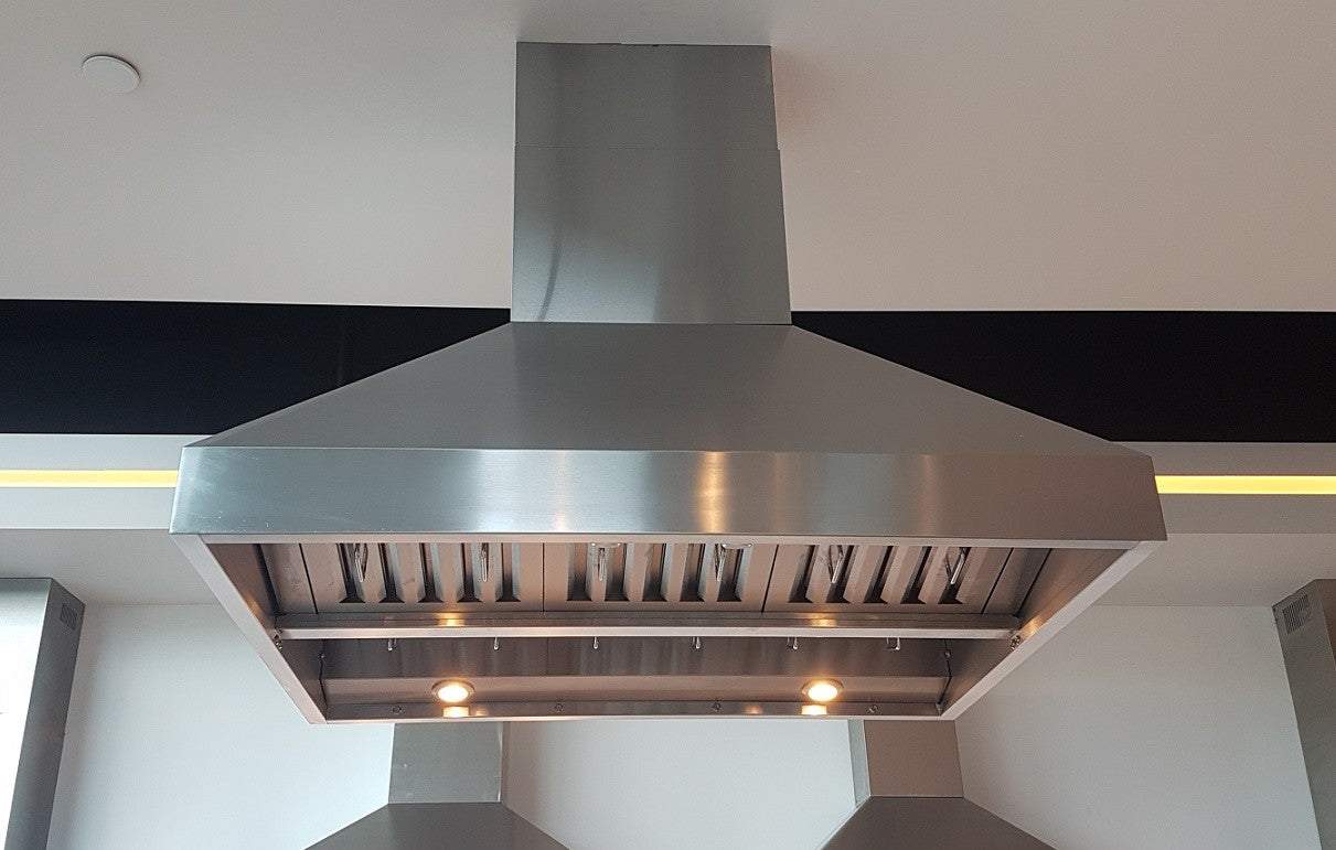 Stainless steel island range hood with wide canopy and vent opening, installed over cooktop