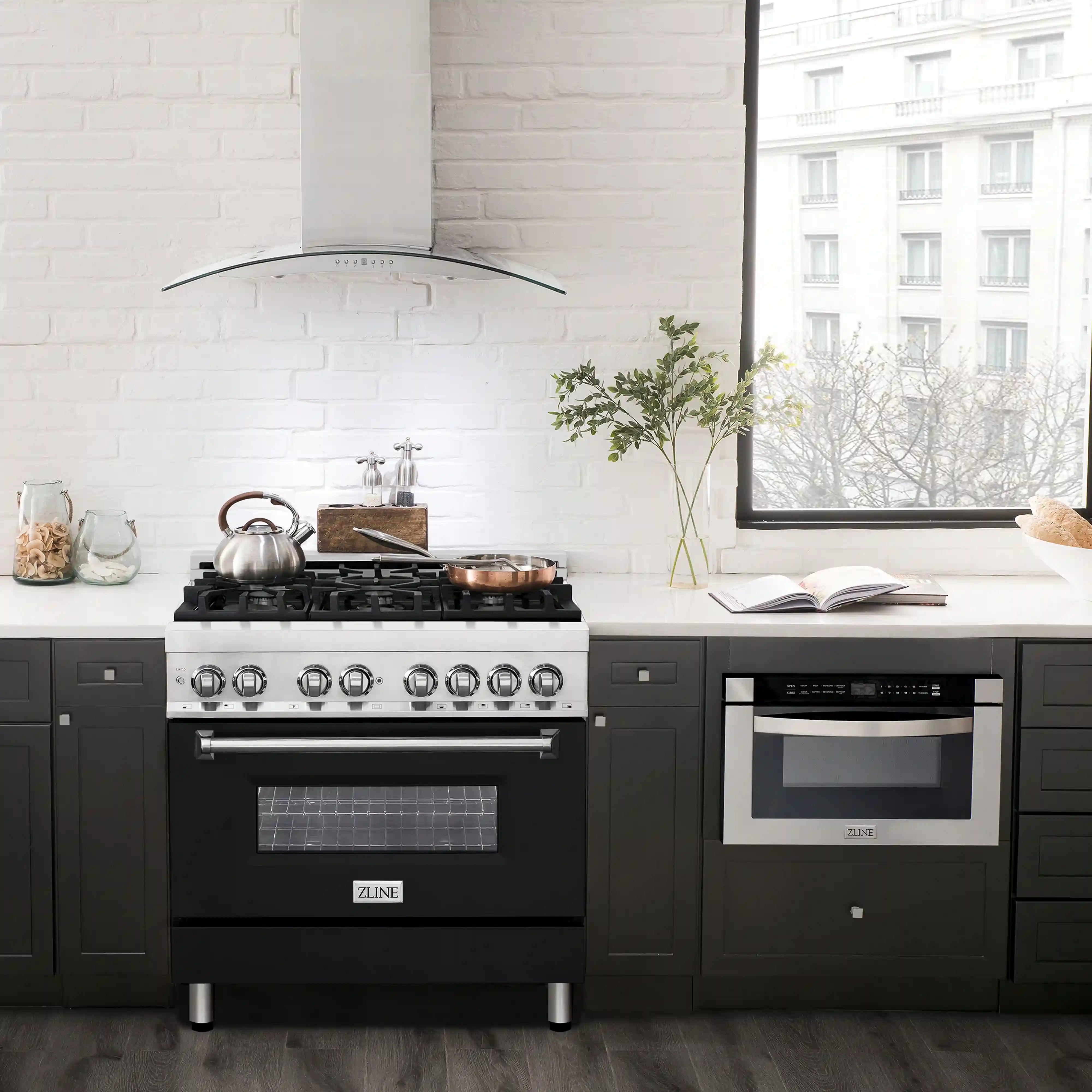 36-inch dual fuel range with black finish, stainless cooktop grates and oven door