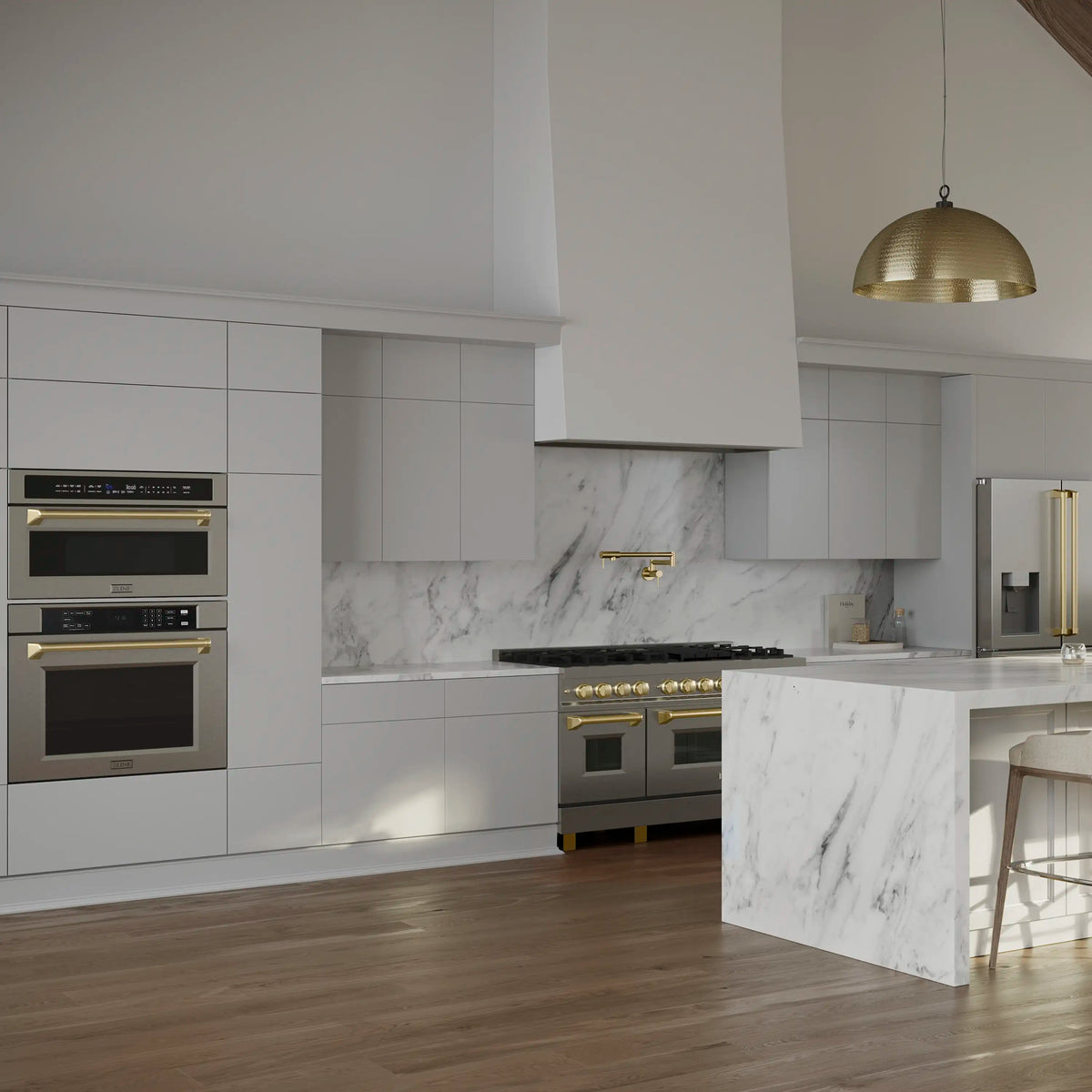 Built-in stainless oven with polished gold handle in modern kitchen cabinetry
