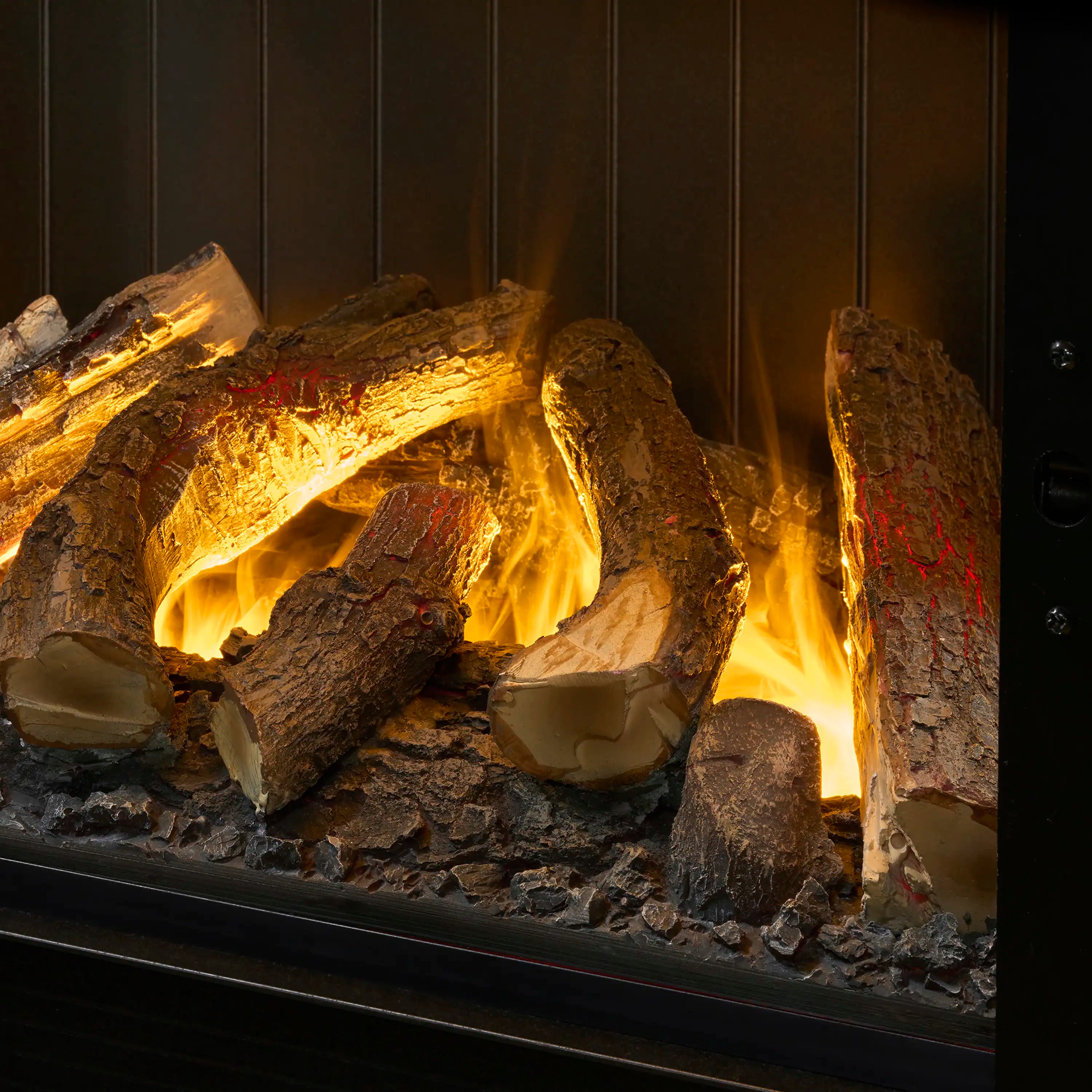 Glowing logs and bright yellow-orange flame effect inside a water vapor fireplace.