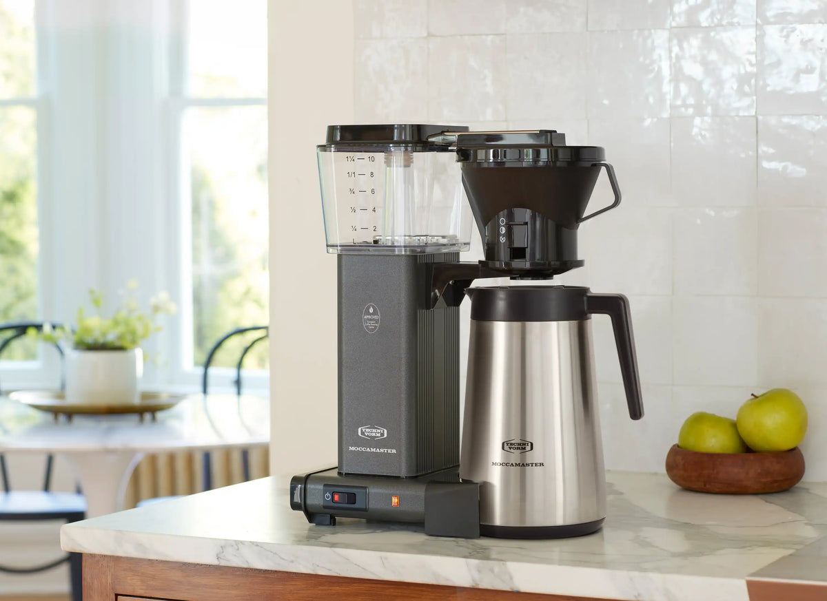 Stone grey coffee maker with transparent water tank and stainless thermal carafe