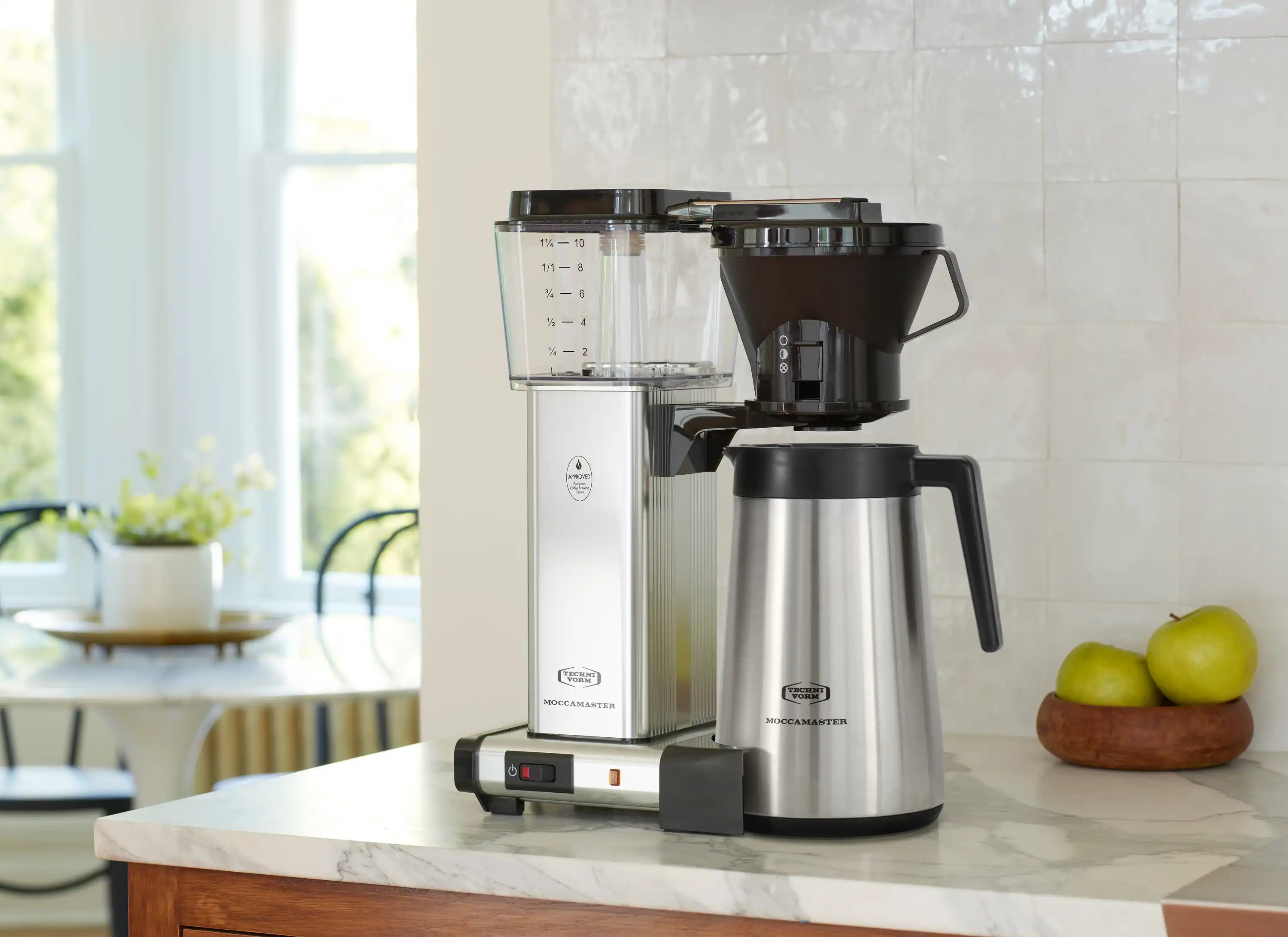 Silver thermal carafe coffee maker with black brew housing and stainless thermal carafe