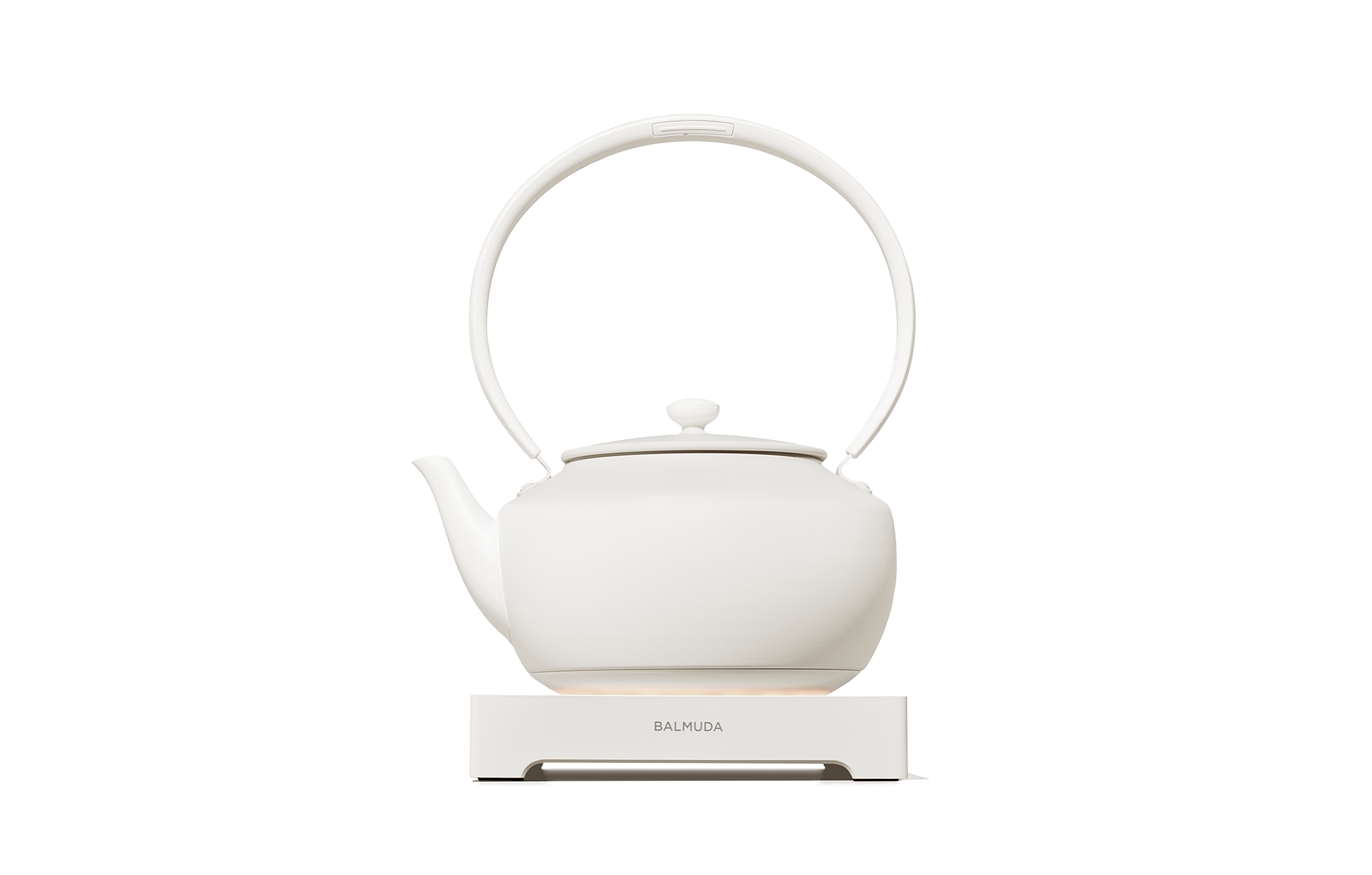 White electric kettle with arched handle, knob lid, and countertop base.