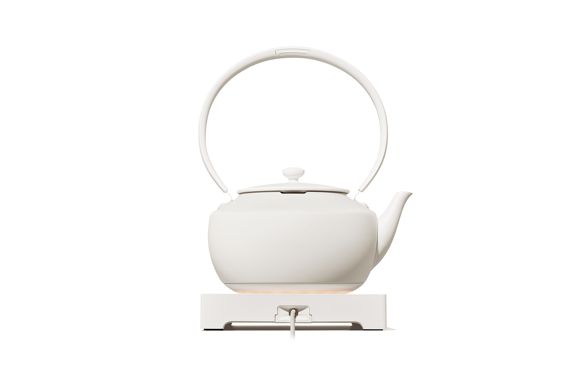 White electric kettle with arched handle, knob lid, and pour spout on base.