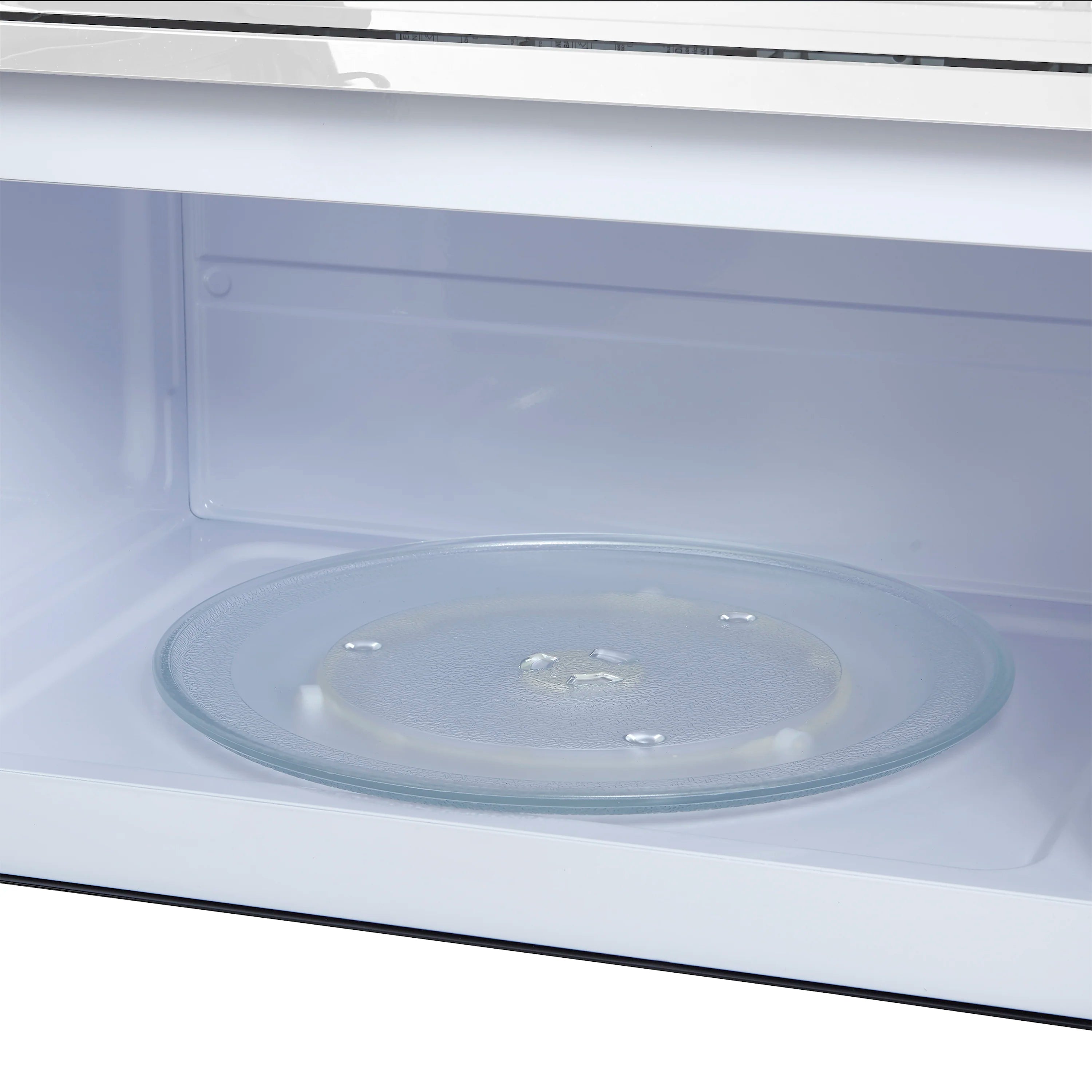 Close view of microwave interior with glass turntable on the oven floor