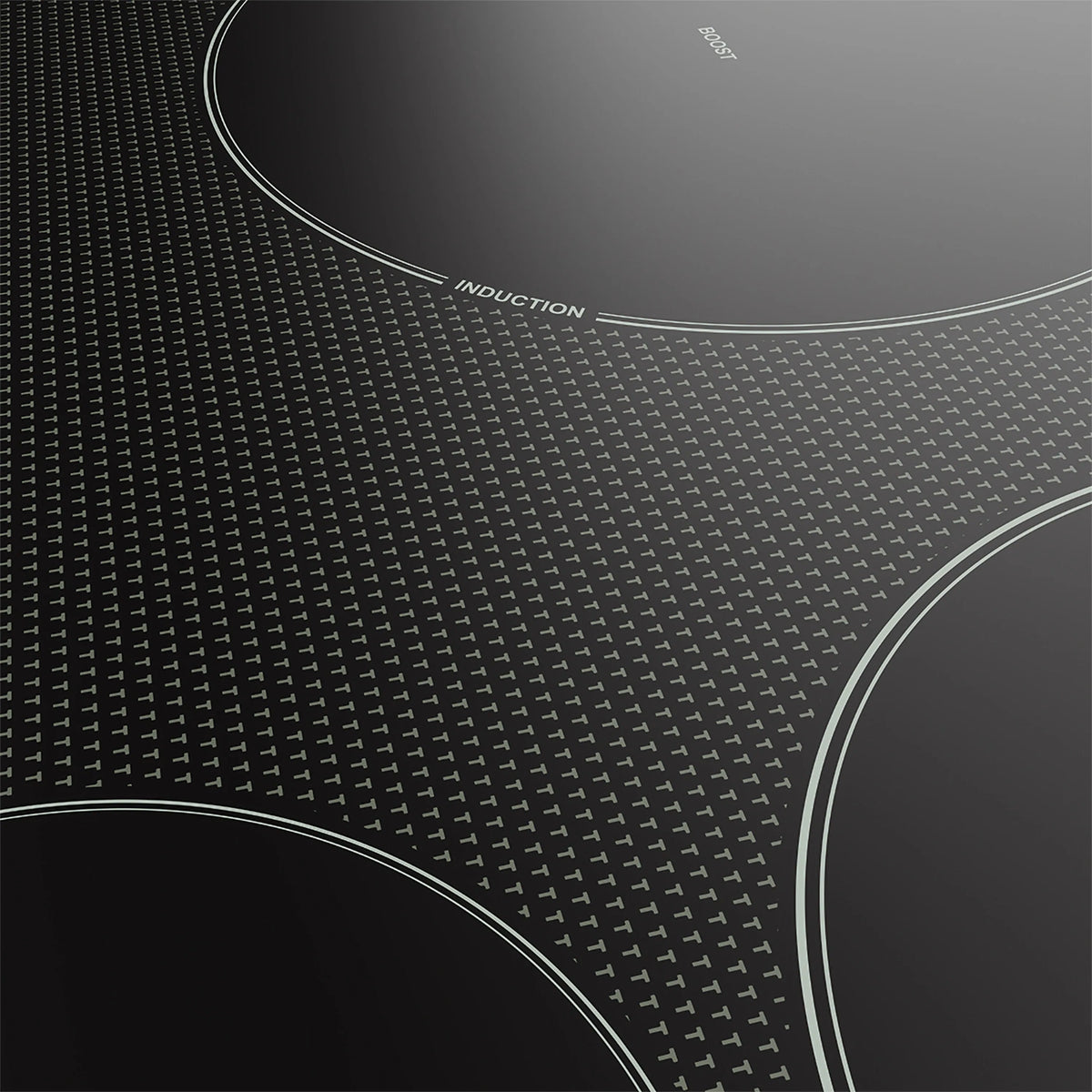 Black induction cooktop surface with “INDUCTION” text and dotted grip texture