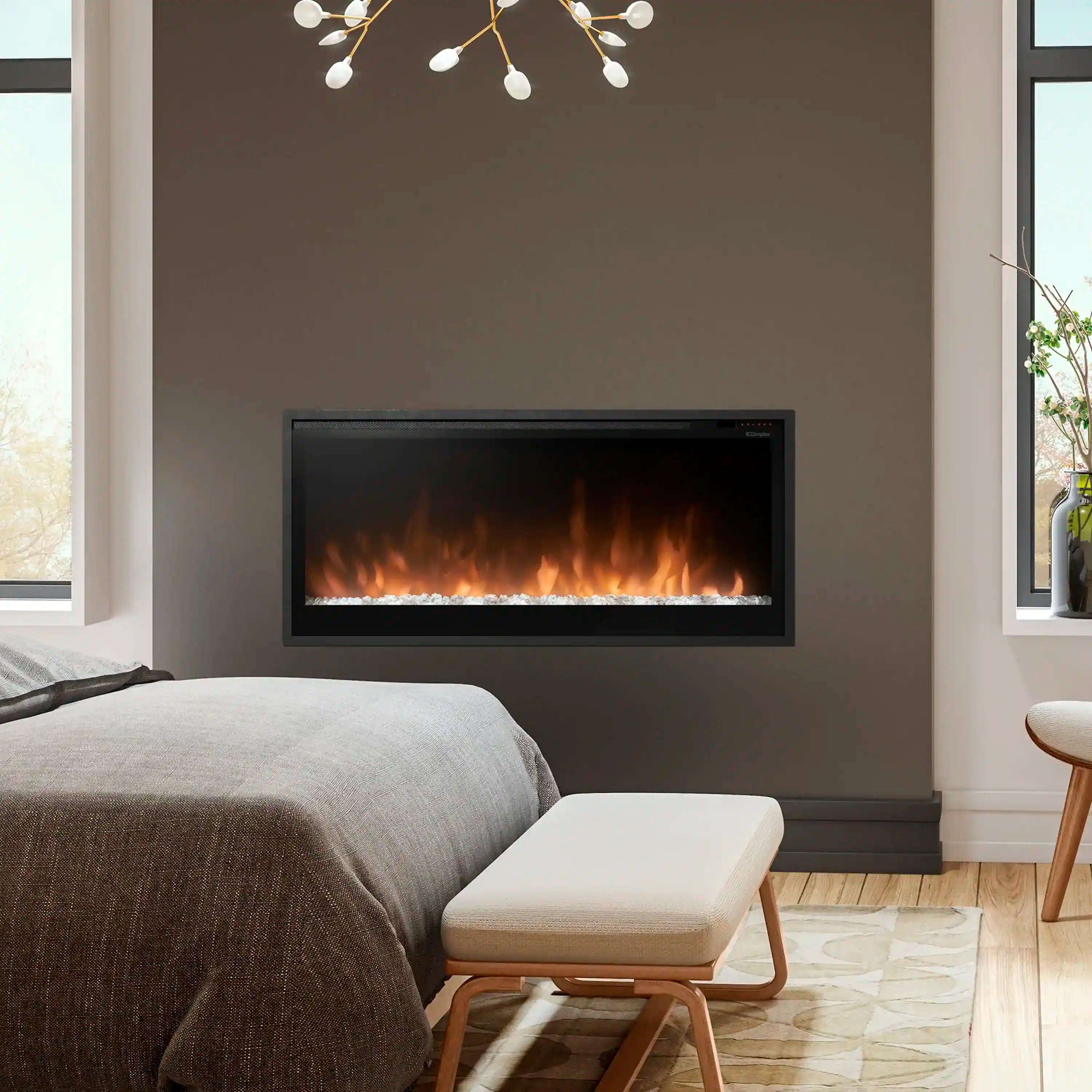 Built-in linear electric fireplace with black trim and glowing flame window in living room