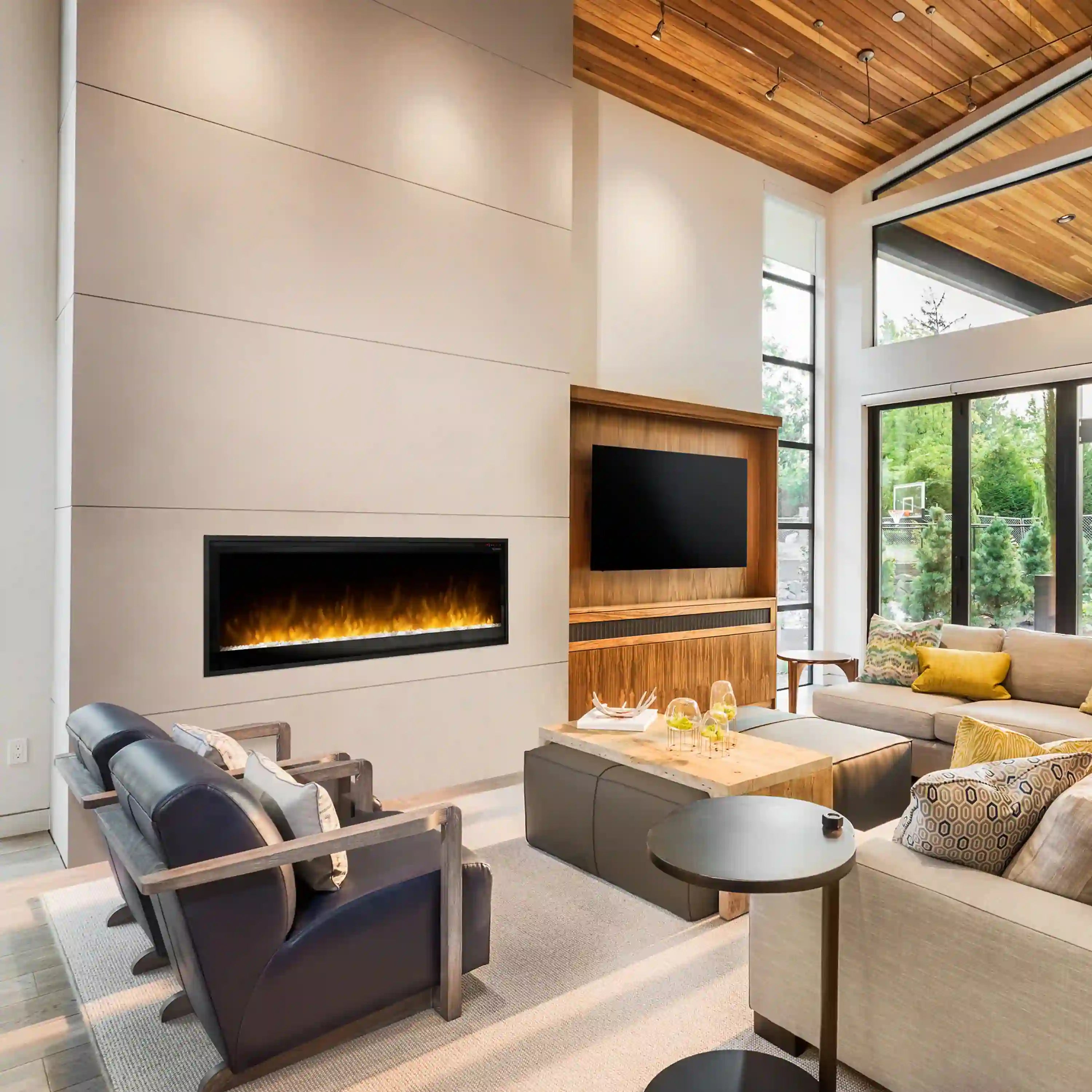 Built-in linear electric fireplace with black trim and visible flame glow