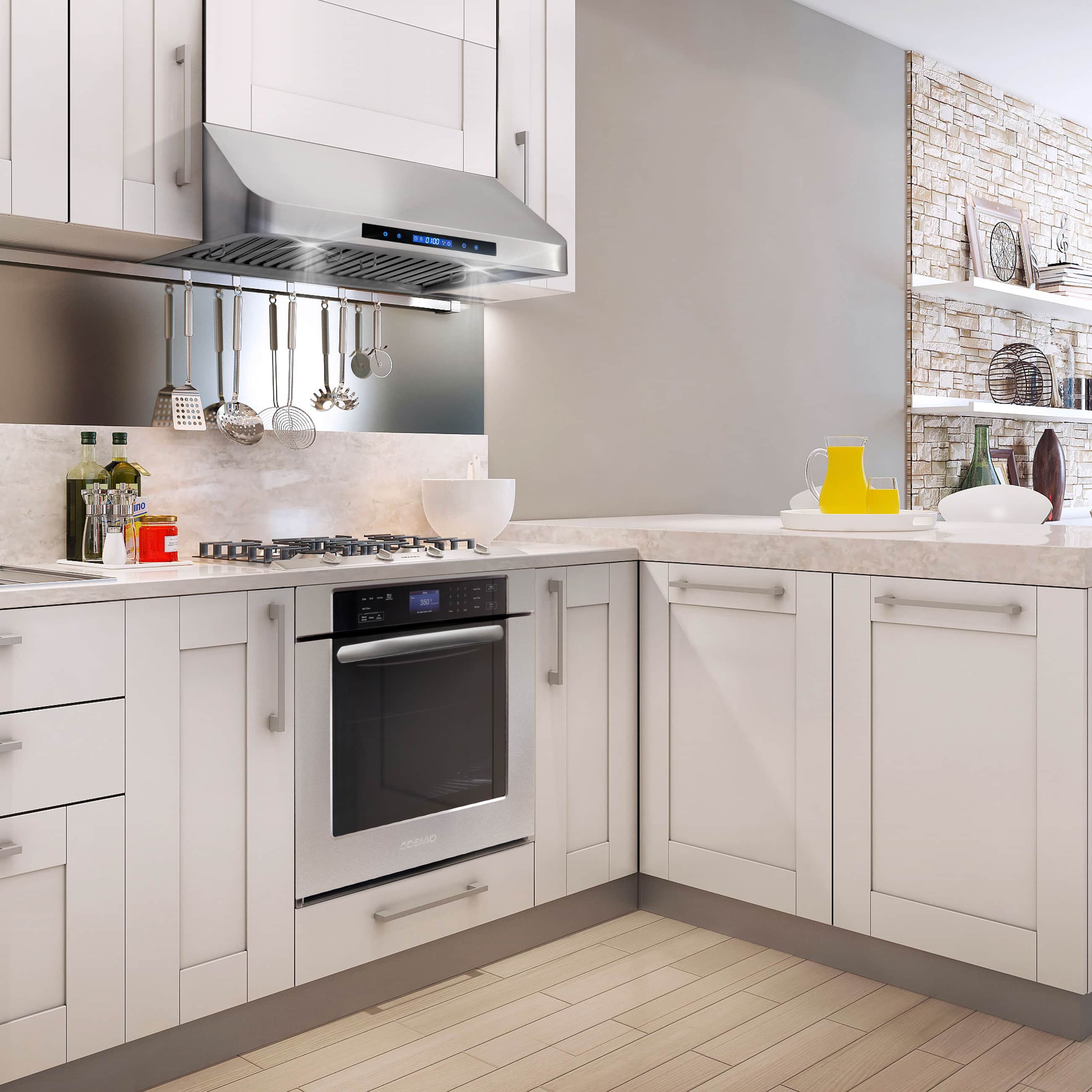 Stainless steel under-cabinet range hood with vent grille and control panel in a kitchen