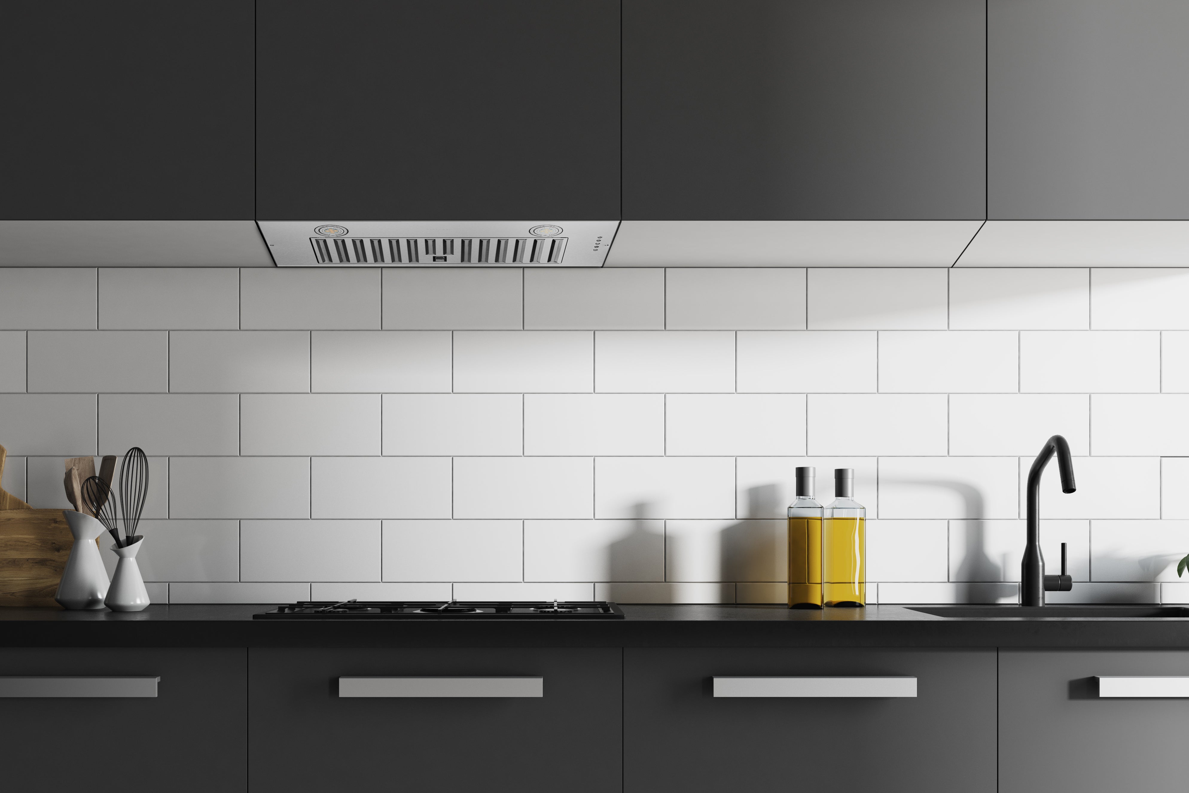 Convertible range hood insert installed above stove with vented filter openings