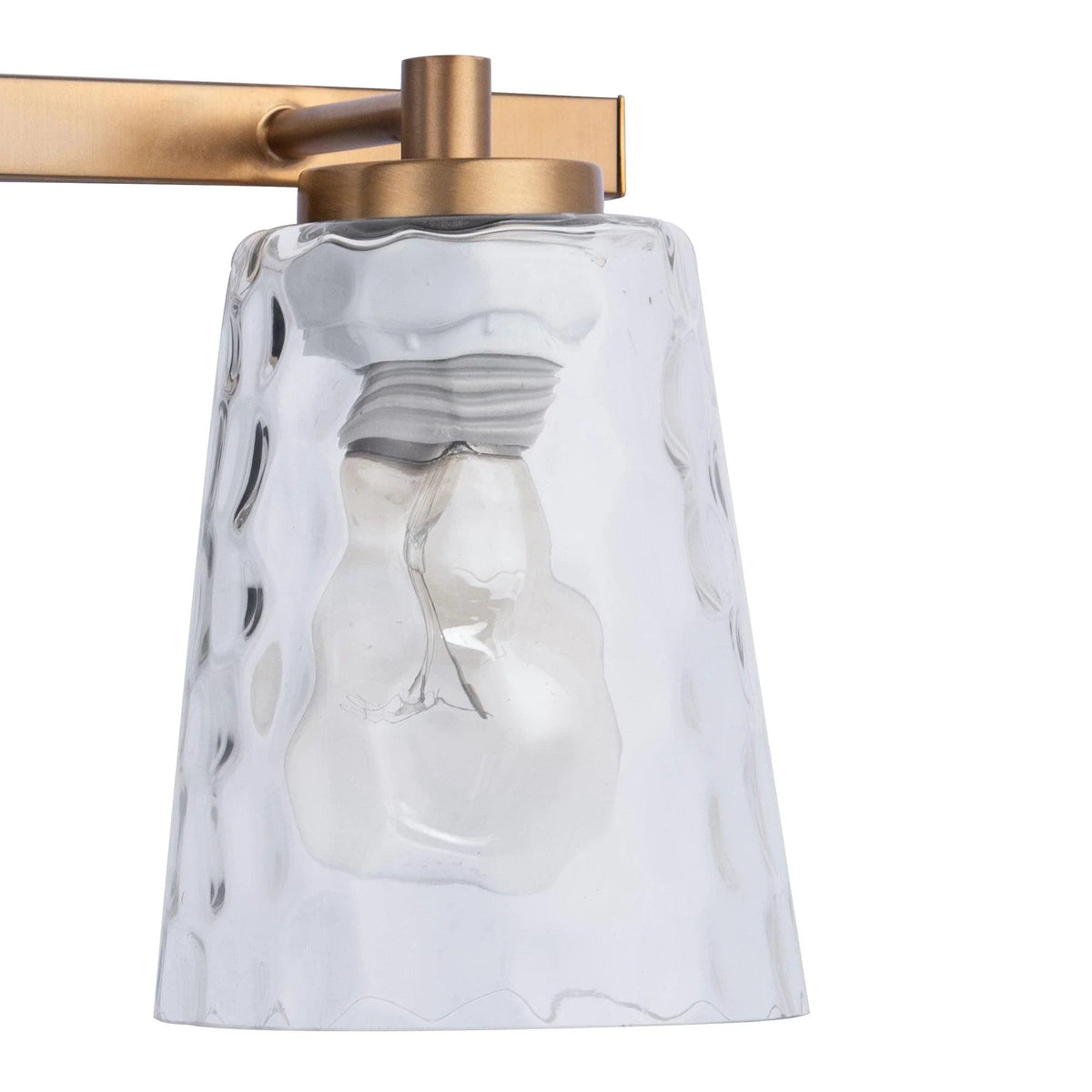 2-light vanity light with clear glass shade and golden metal top cap.