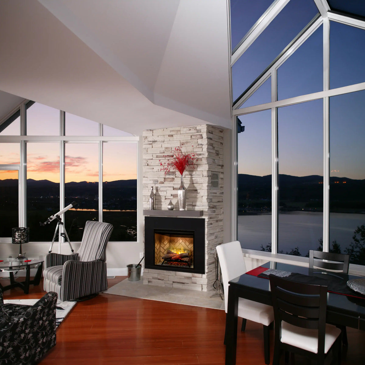 Black fireplace surround trim installed in a modern room against a stone wall