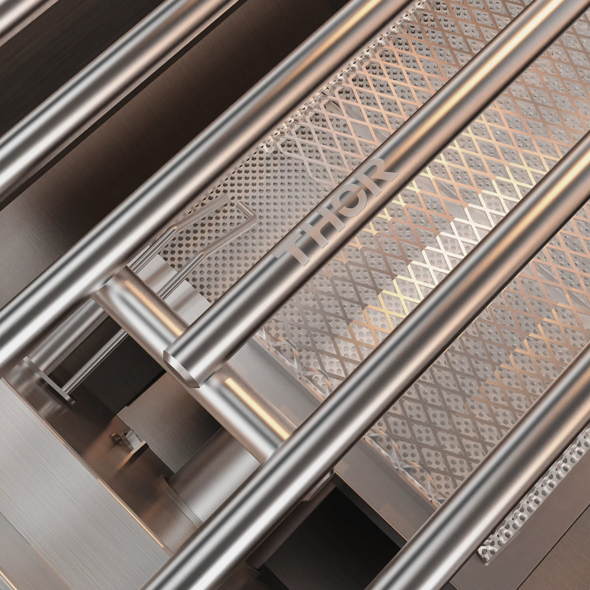 Stainless steel grill burner tubes and grate underside detail