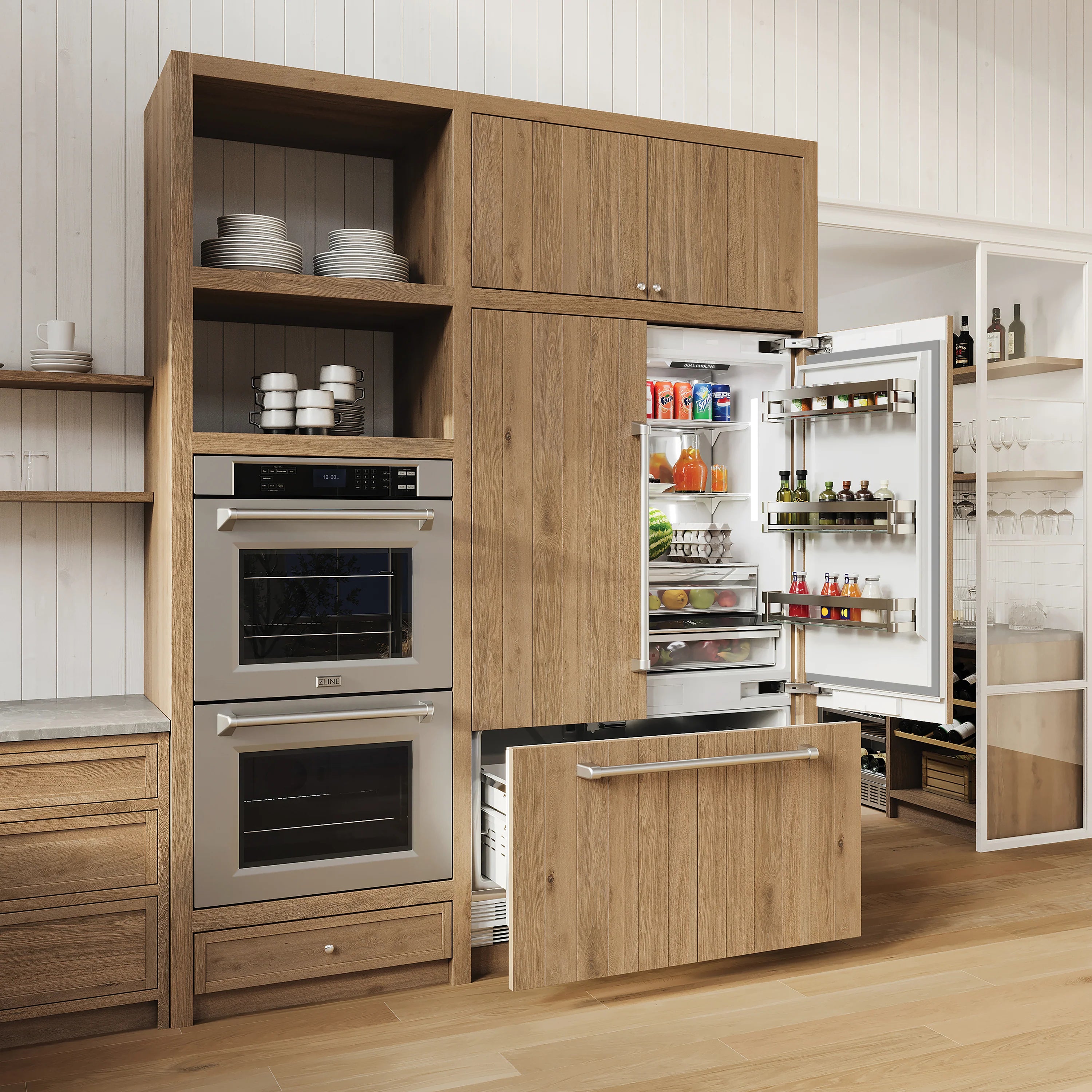 Built-in double wall oven and refrigerator with open doors in wood cabinetry