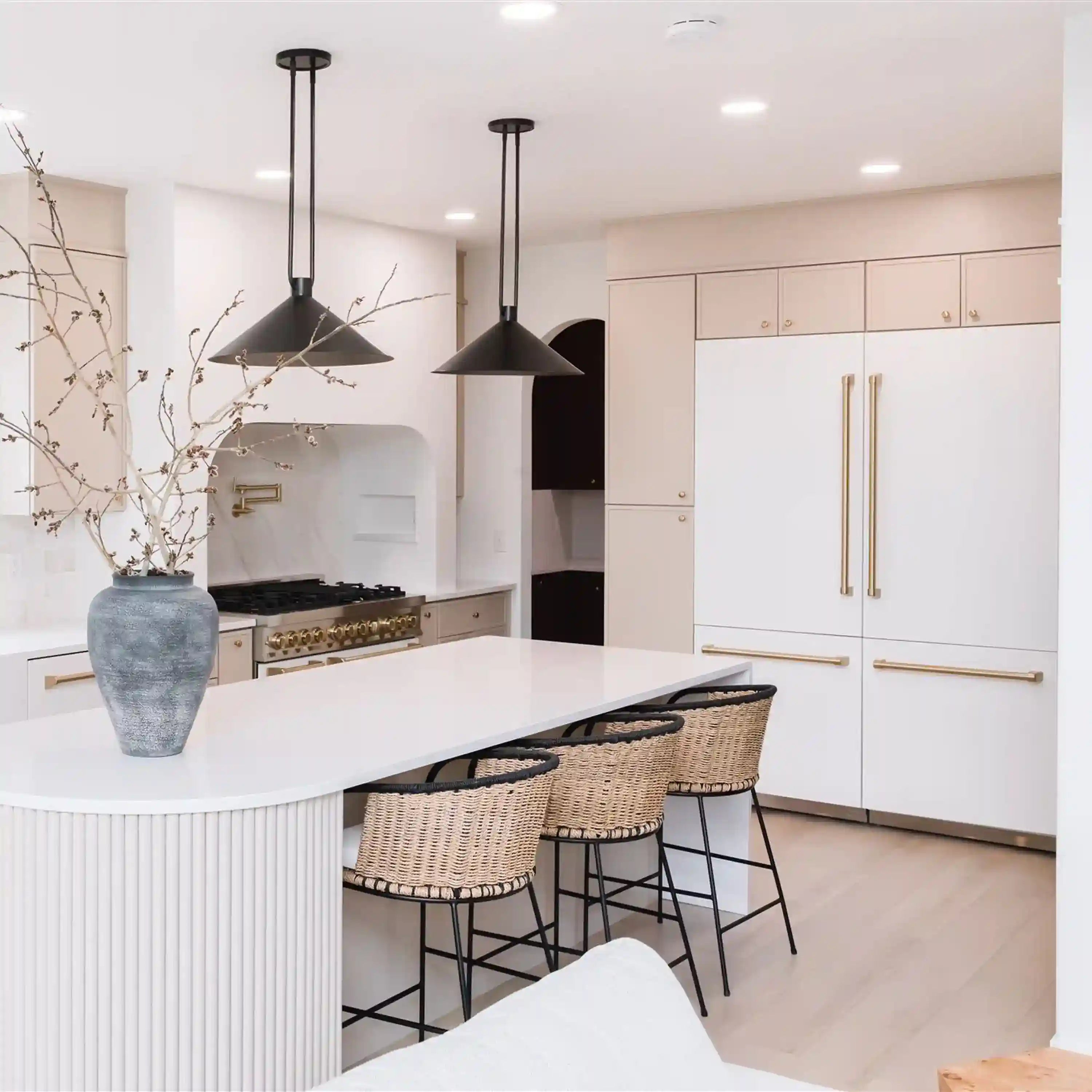 Built-in white French-door refrigerator with gold bar handles
