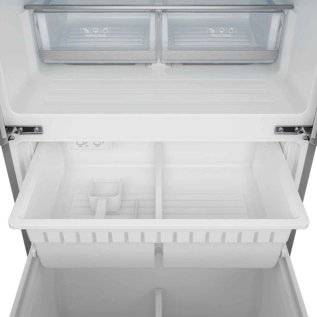 Refrigerator freezer interior with clear bins and white shelving