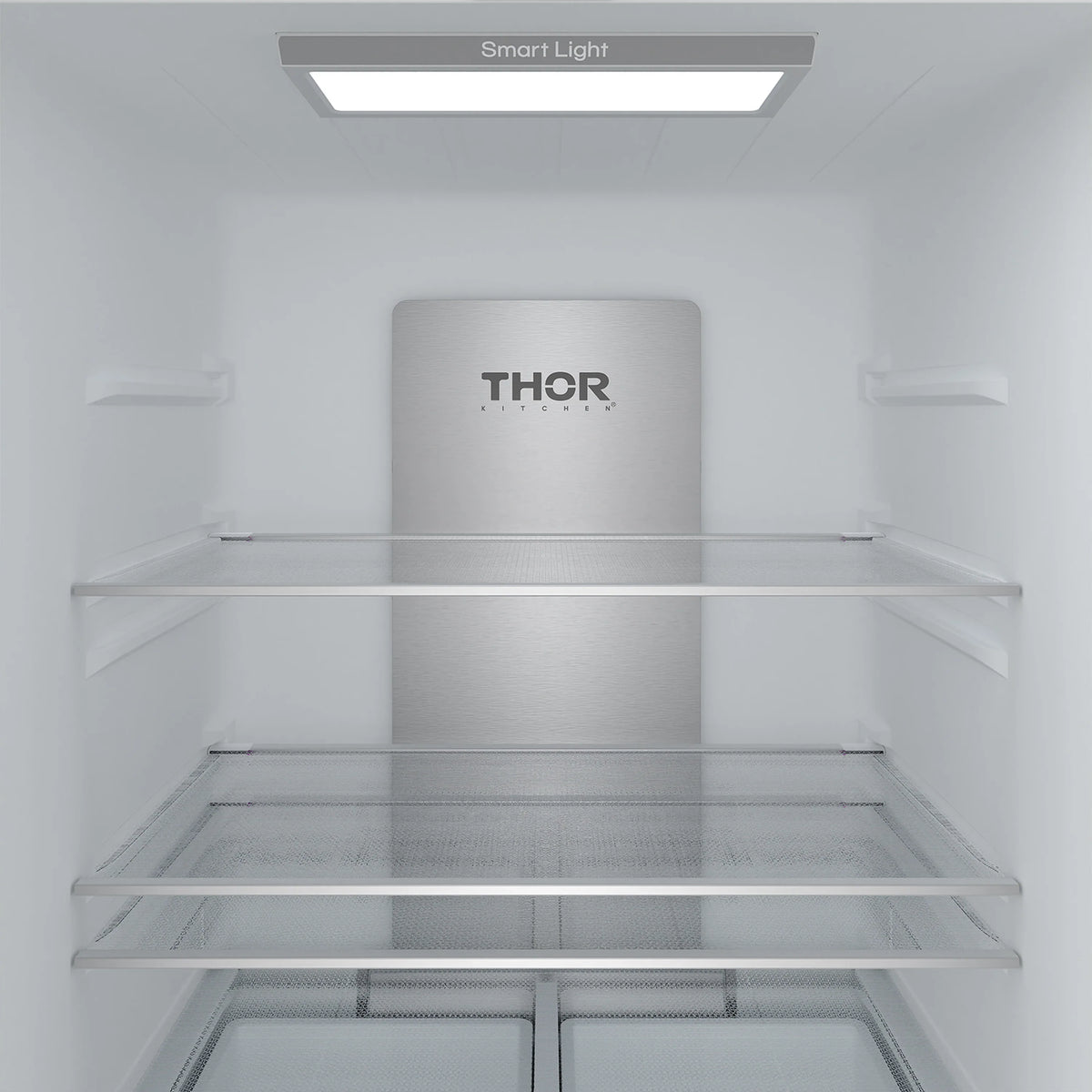 Refrigerator freezer compartment interior with THOR logo, glass shelf and drawer rails