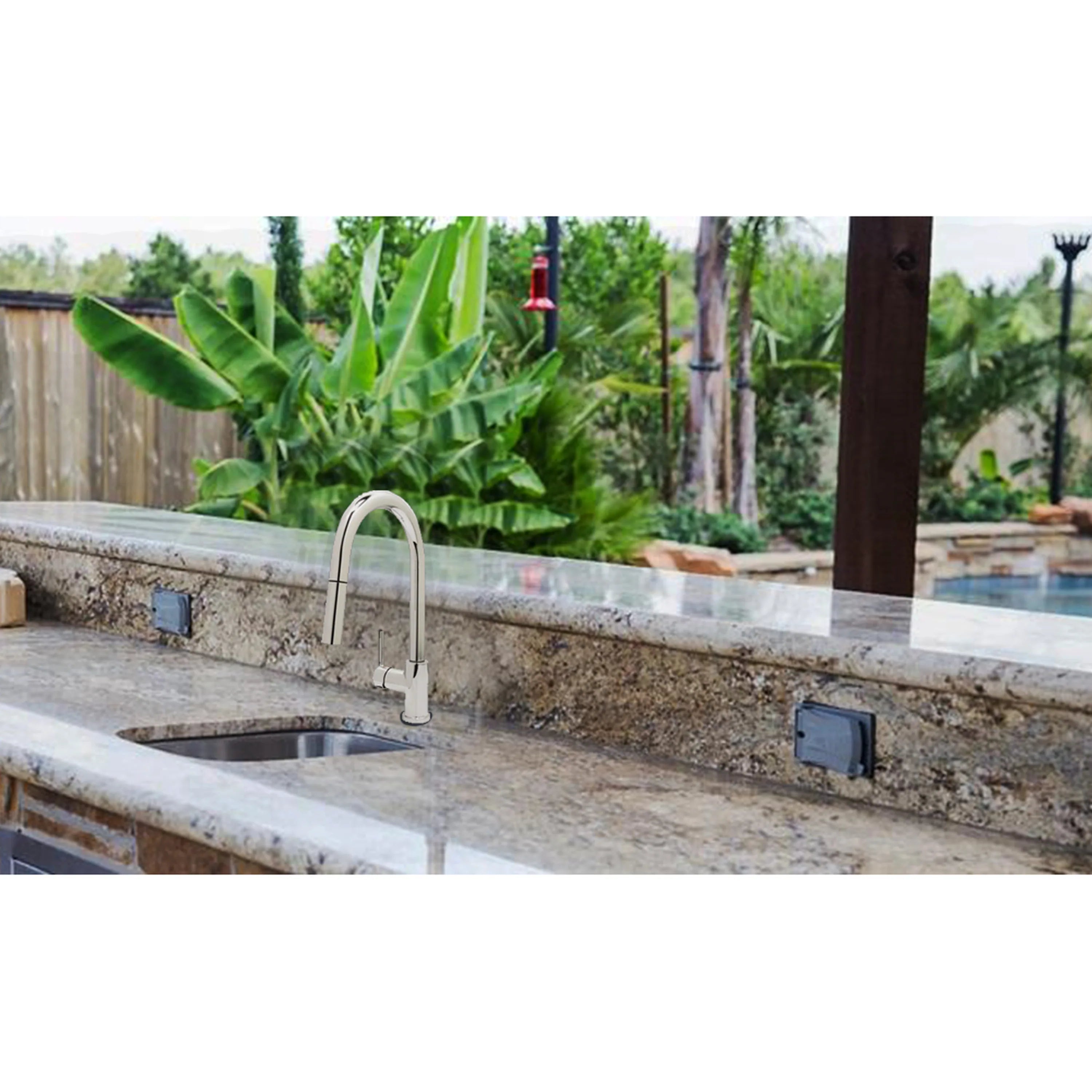 Stainless steel undermount sink with tall gooseneck faucet on outdoor countertop
