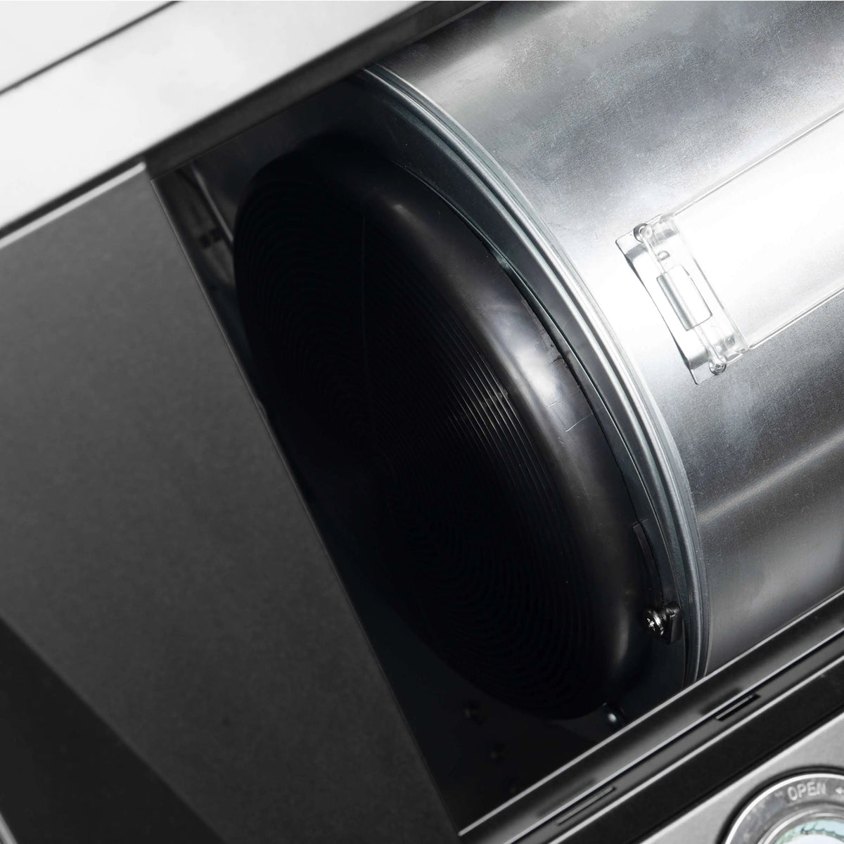 Black microwave oven interior fan with circular vent opening