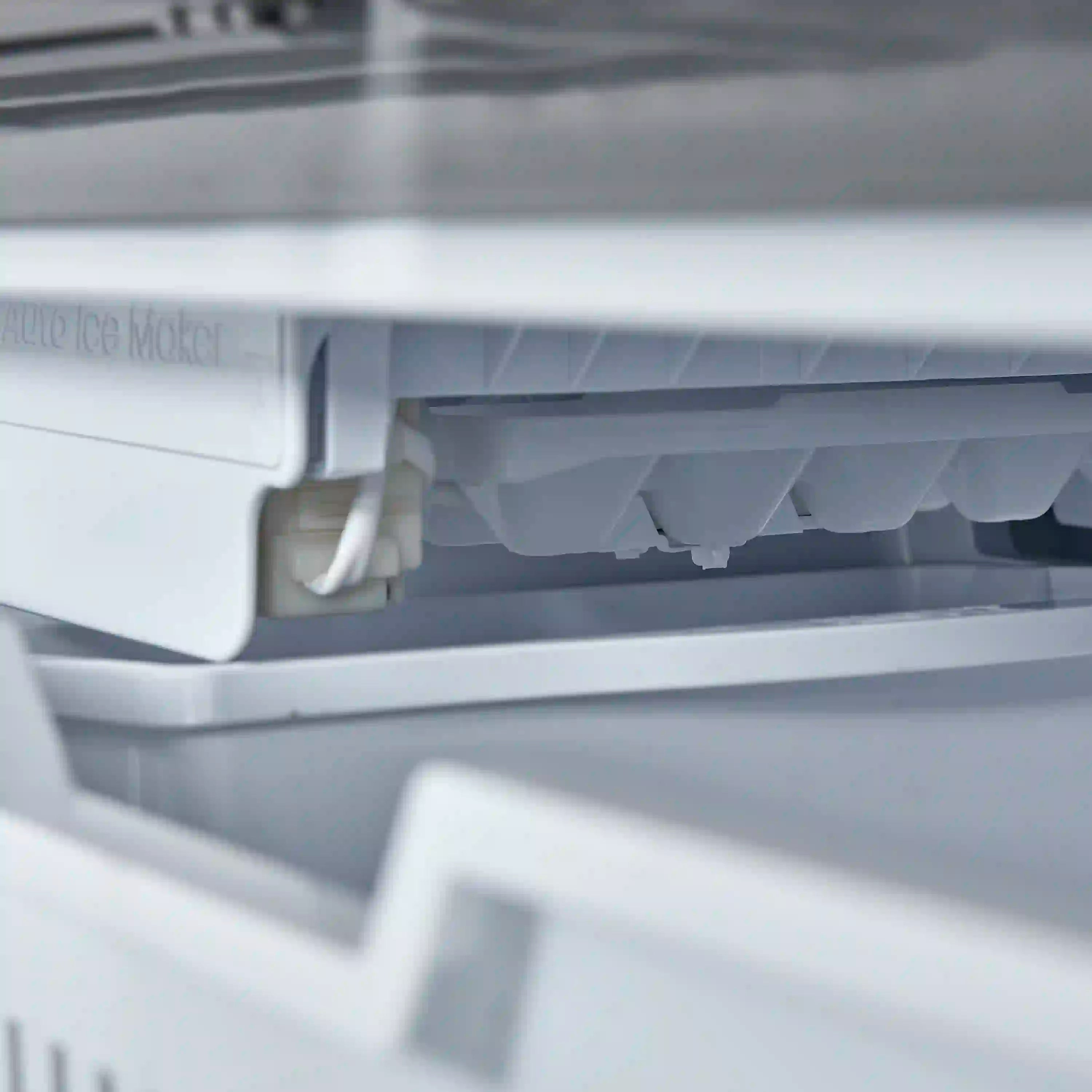 Close-up of freezer interior chute and vented panel under the dispenser area
