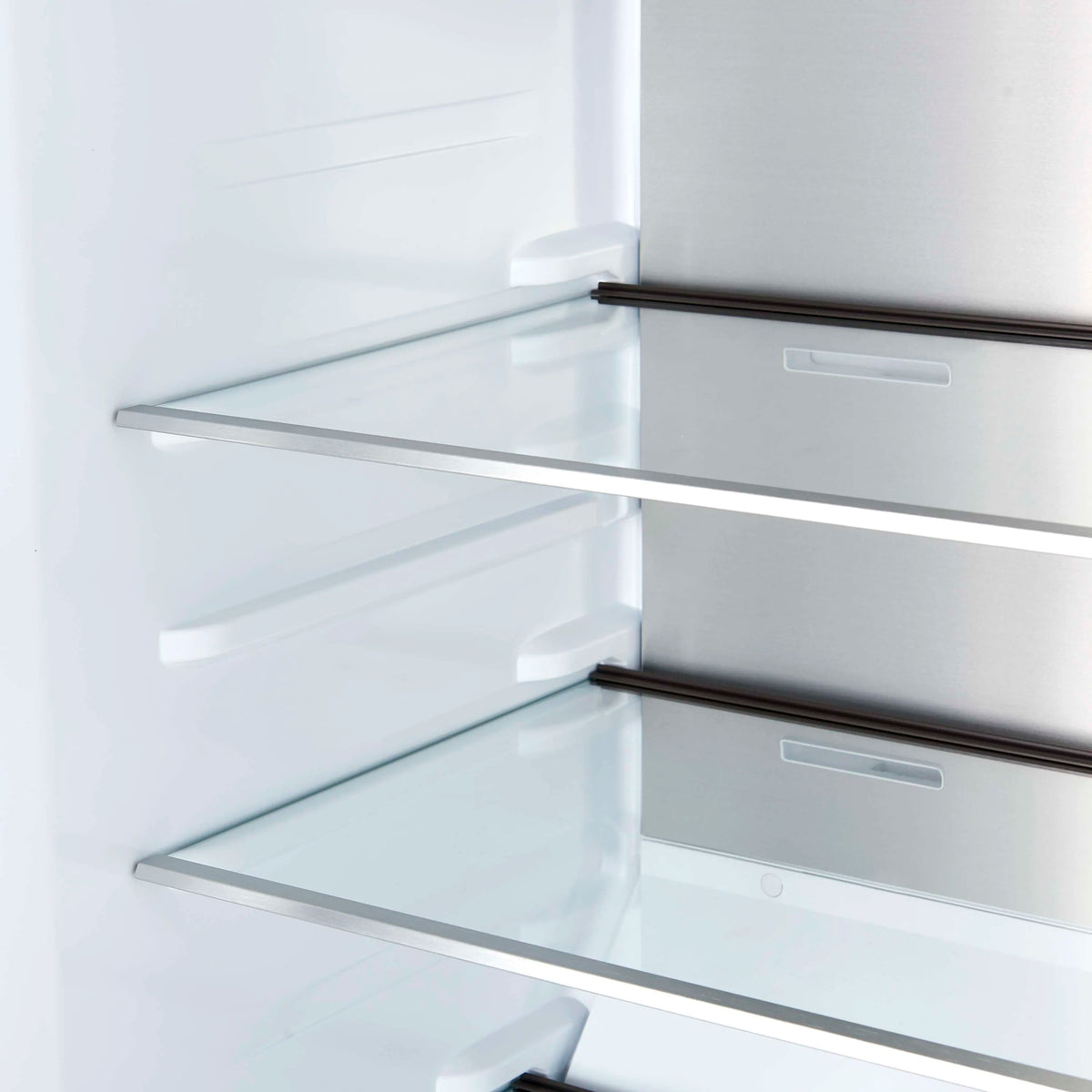 Refrigerator door shelf area with clear glass shelves and white brackets