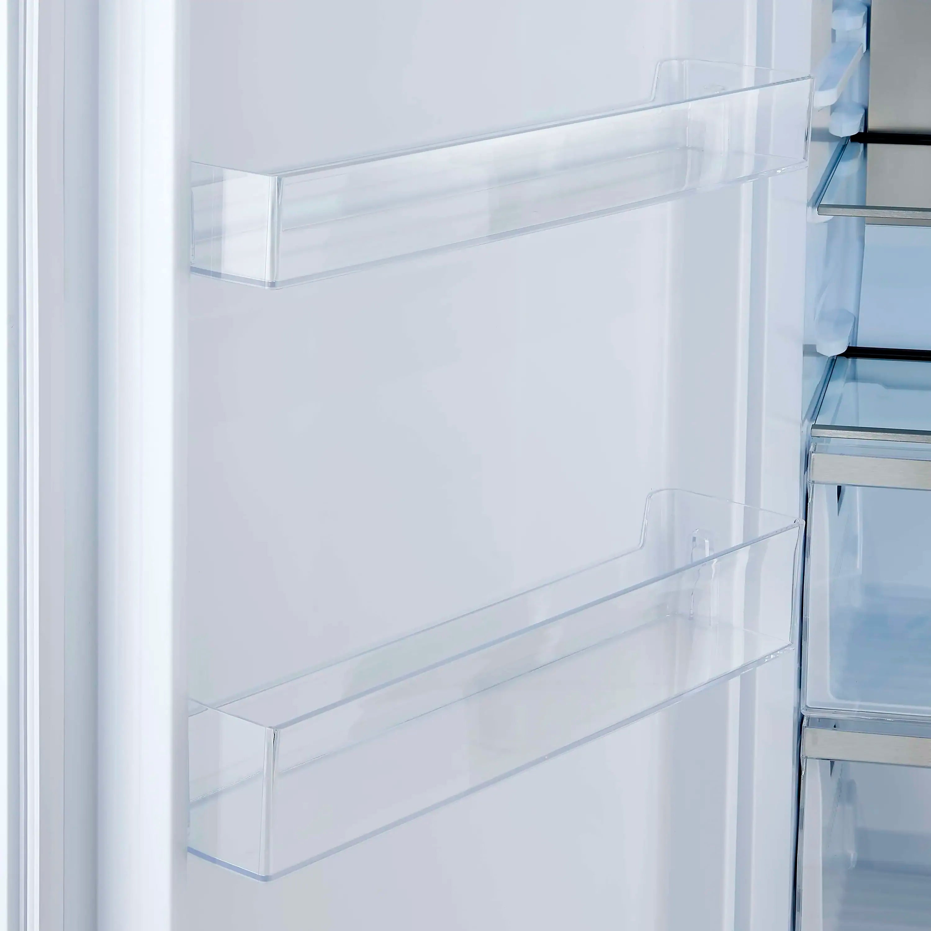White refrigerator door with clear storage bin and raised shelf lip.
