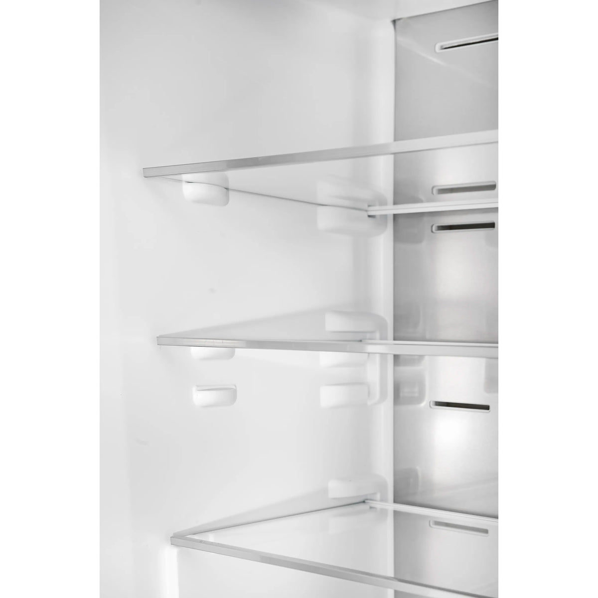 Bottom freezer interior with multiple shelves and integrated door storage