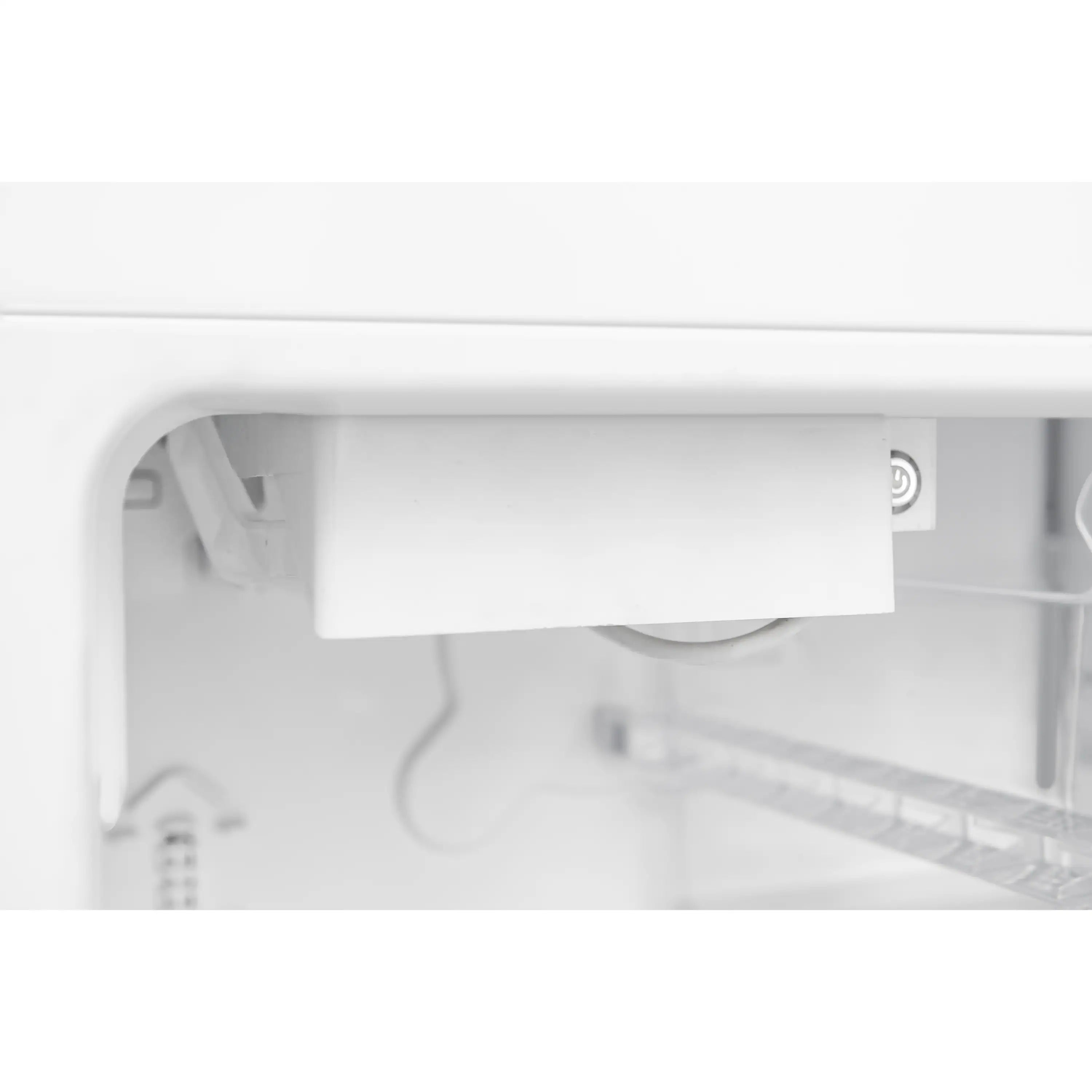 Refrigerator interior side view with white shelf ledge and wiring components.