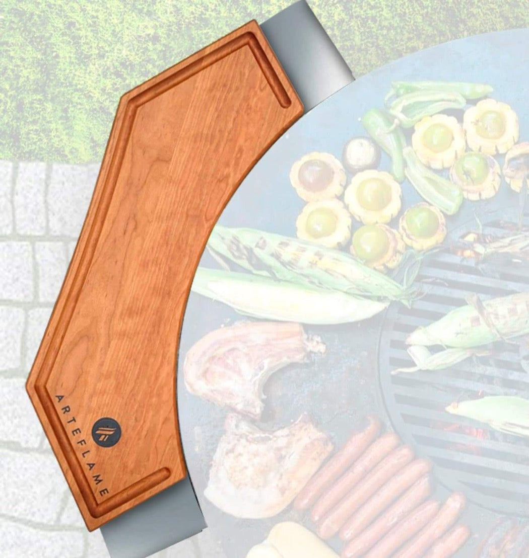 Cherry wood cutting block with Arteflame logo and tapered handle edge