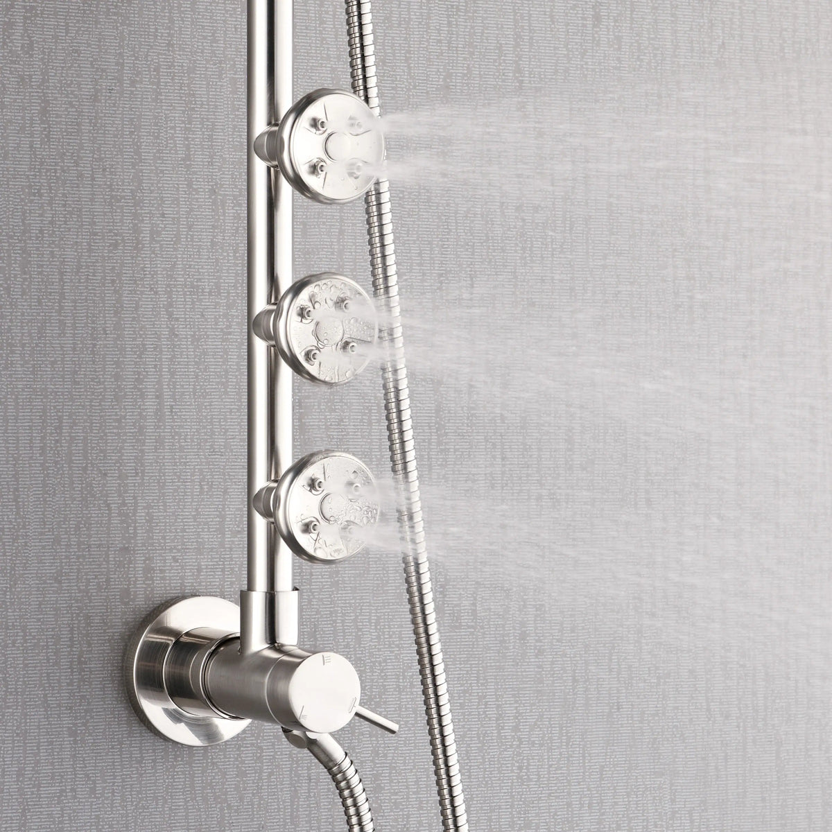 Brushed nickel shower diverter controls with body jets and handheld hose