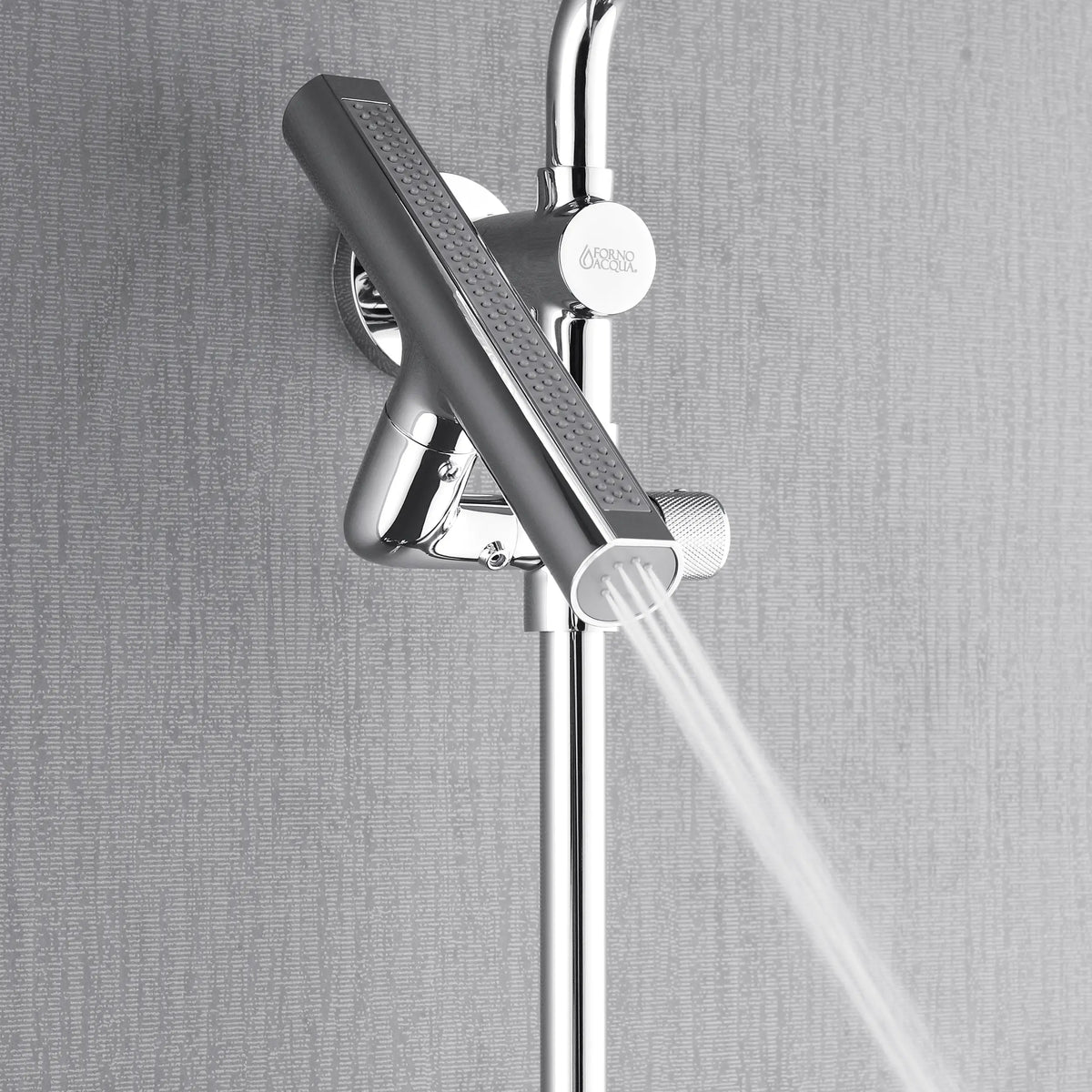 Polished stainless steel handheld shower spraying water from the vertical bar