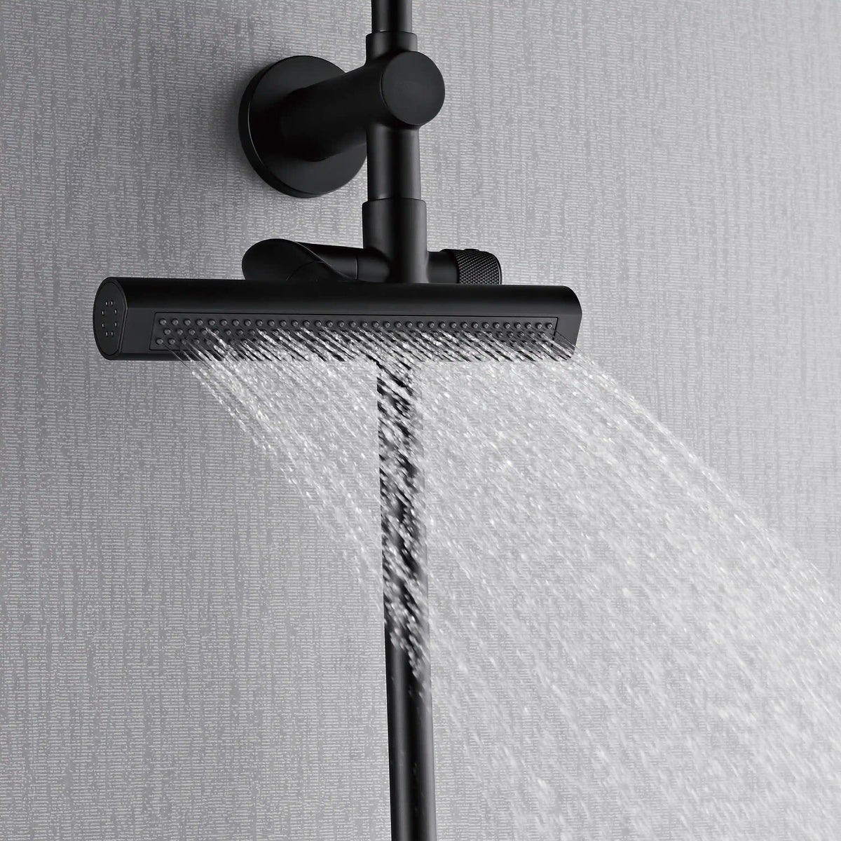 Matte black overhead shower head releasing a strong rainfall stream