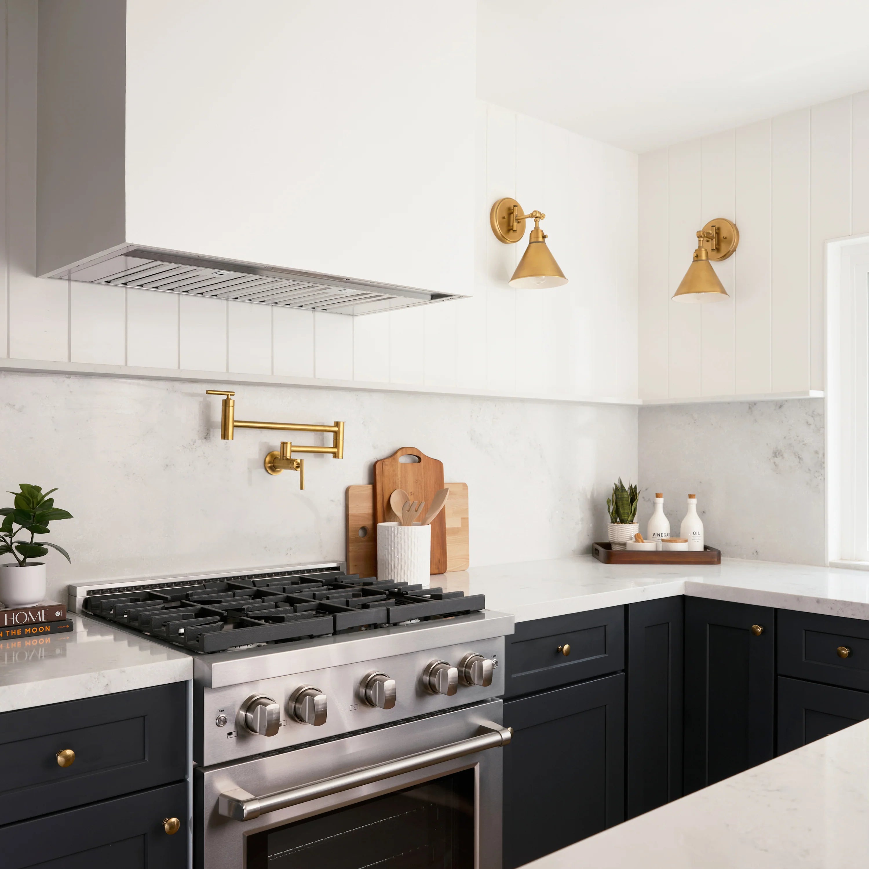 Stainless steel gas range in modern kitchen with stainless trim and oven door
