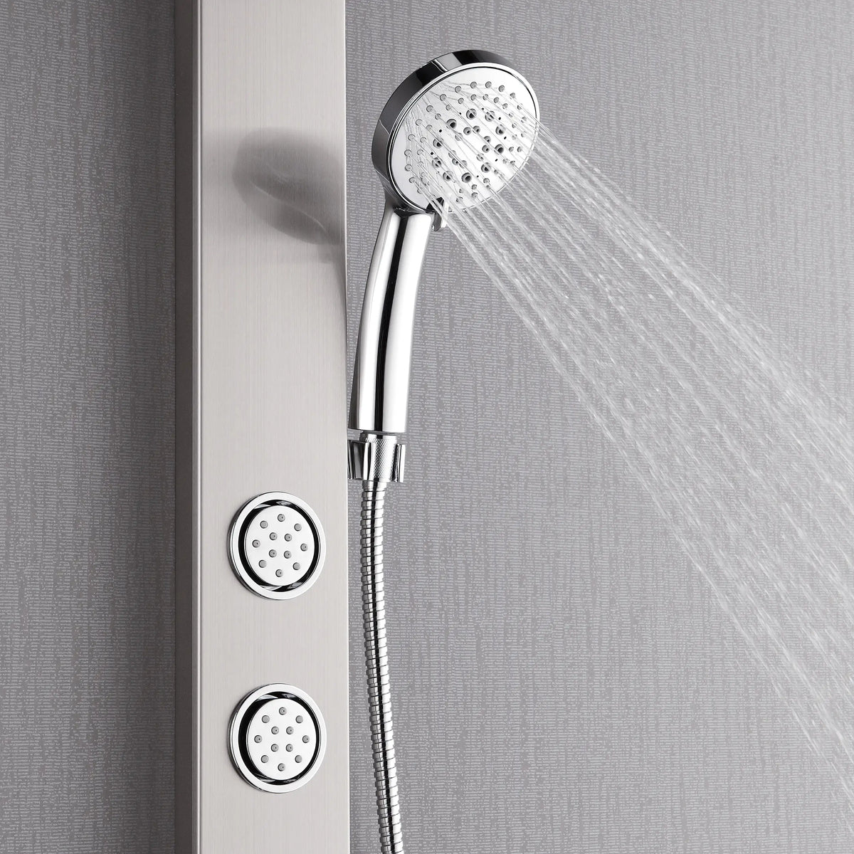 Stainless steel handheld spray head releasing water with body jet nozzles on panel