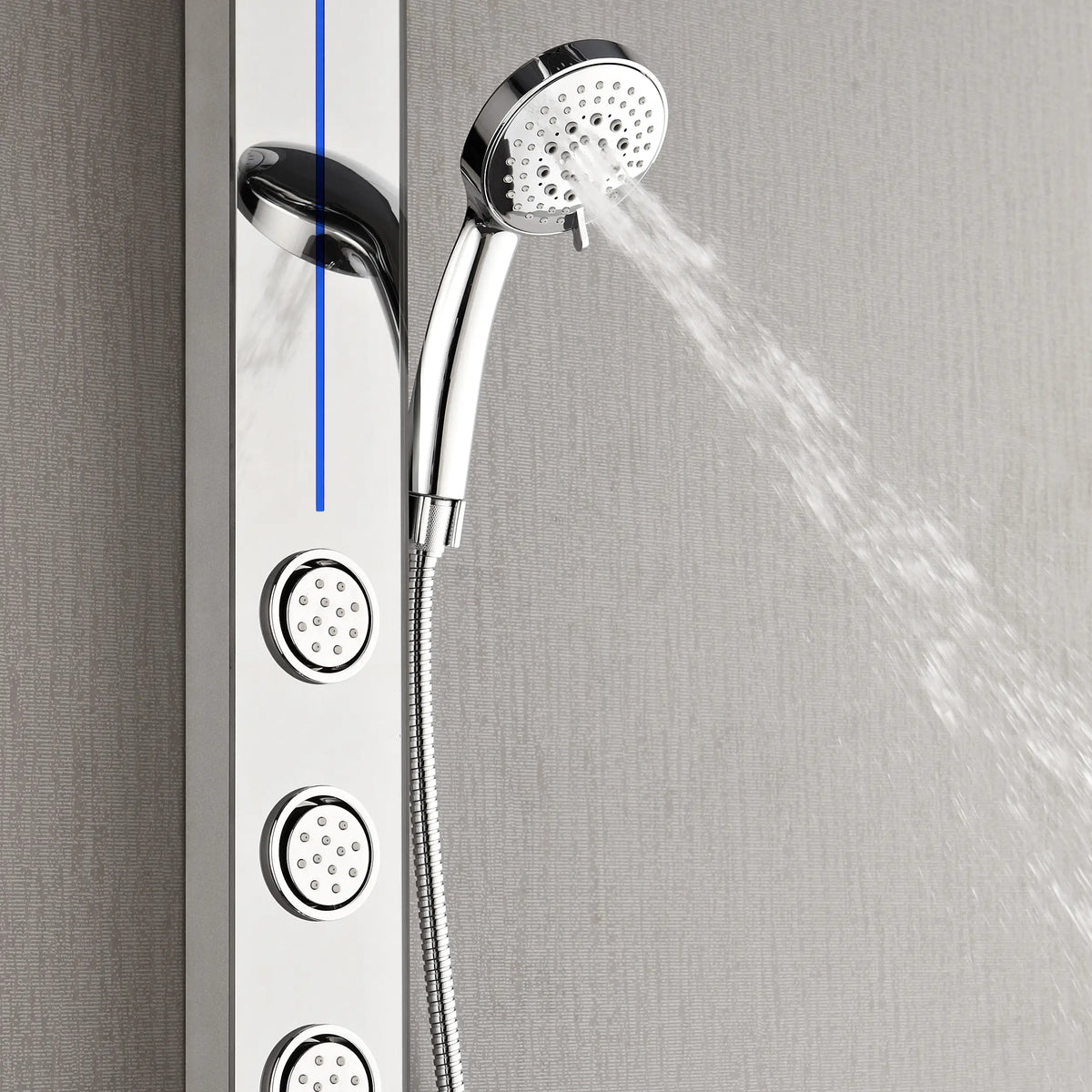 Mirrored stainless steel body jet panel with handheld shower spraying water