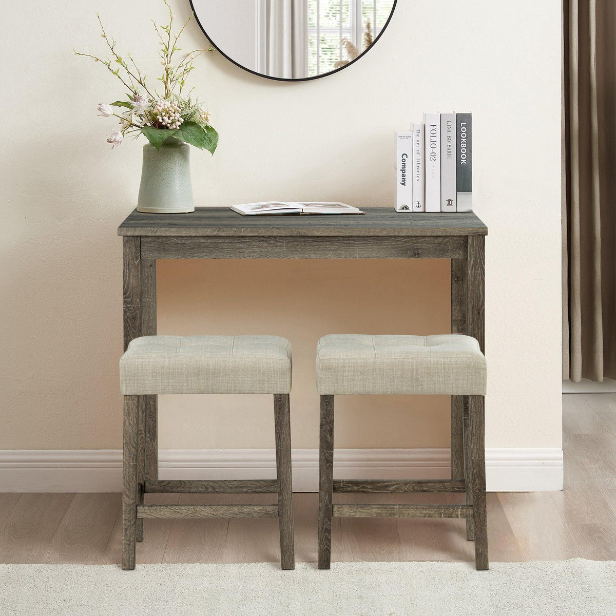 Brown dining table set with two beige upholstered stools, cushioned seats and ladder backs