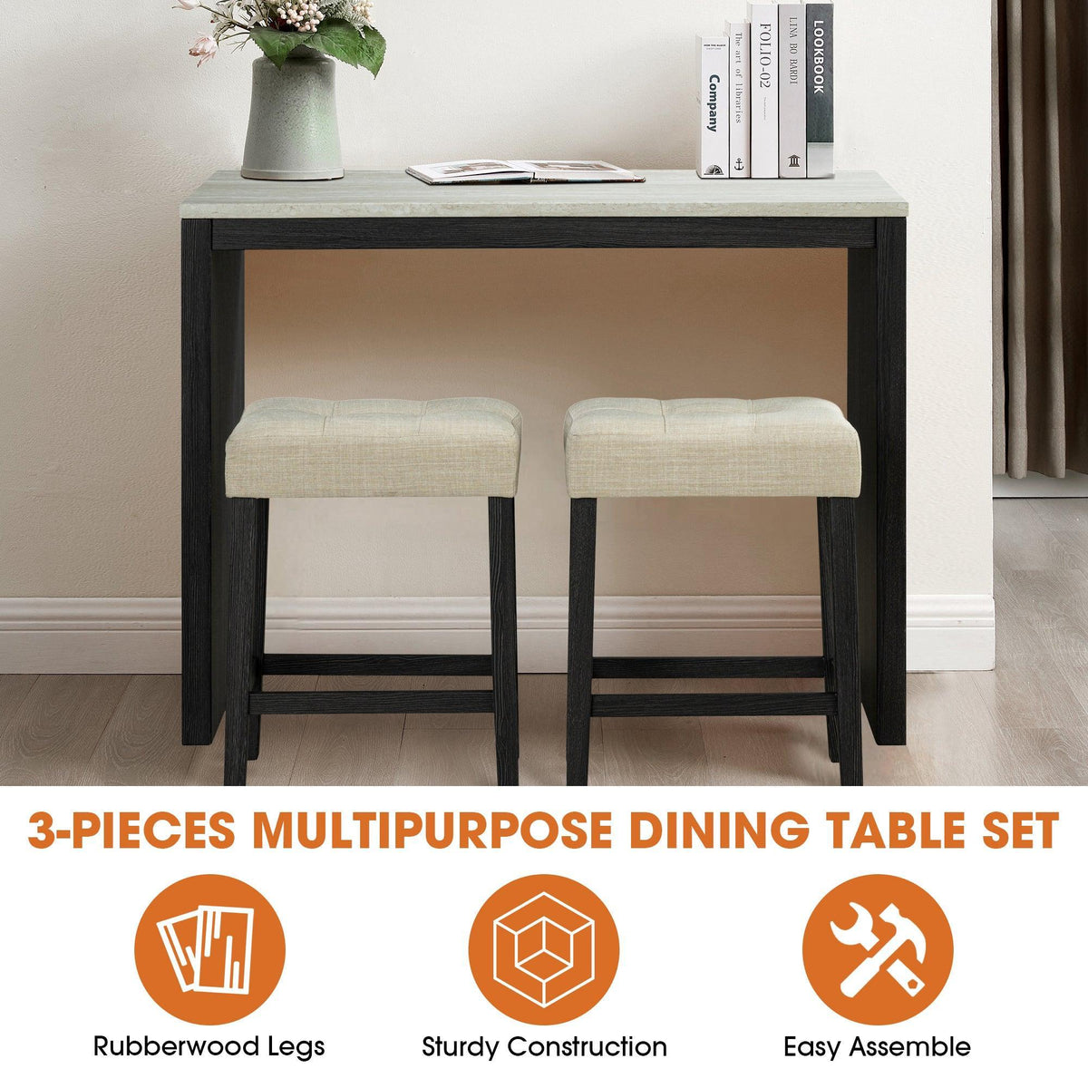 Black dining table set with two beige upholstered stools, rectangular top